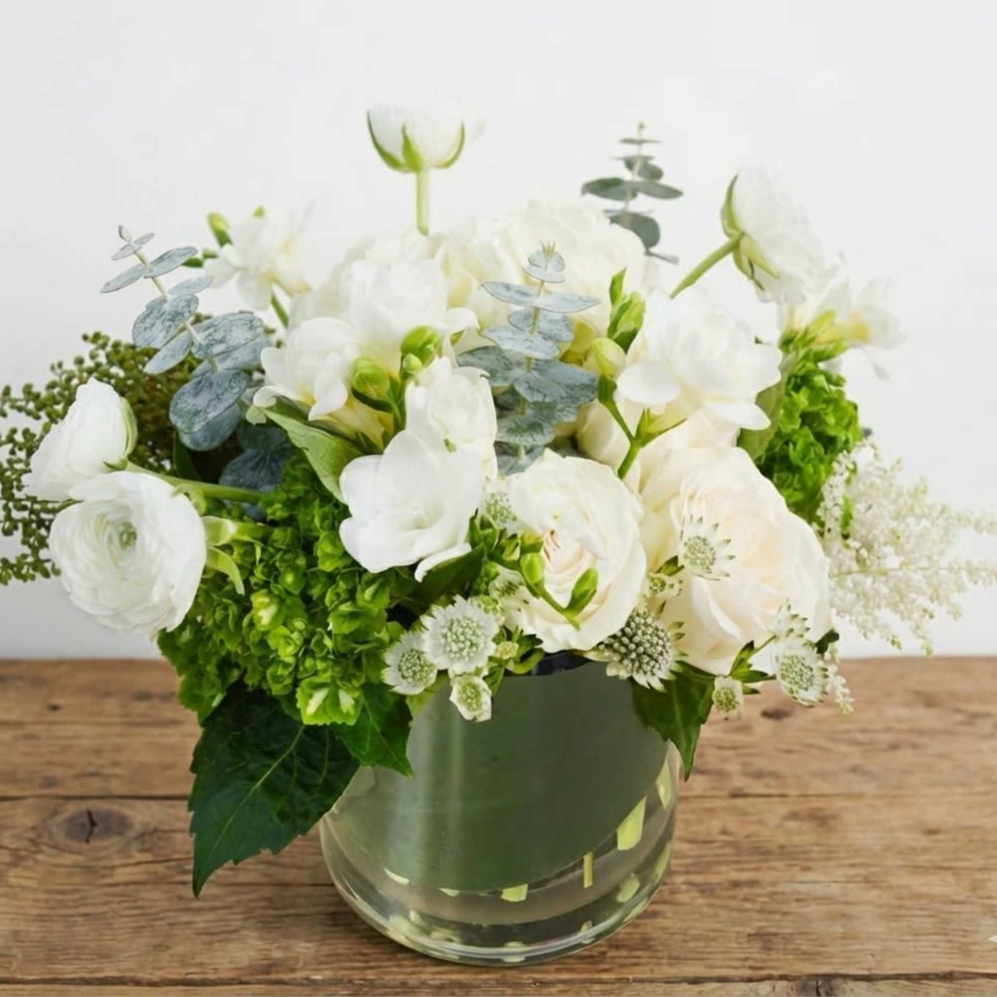 The arrangement states in very chic white and green color. Due to
