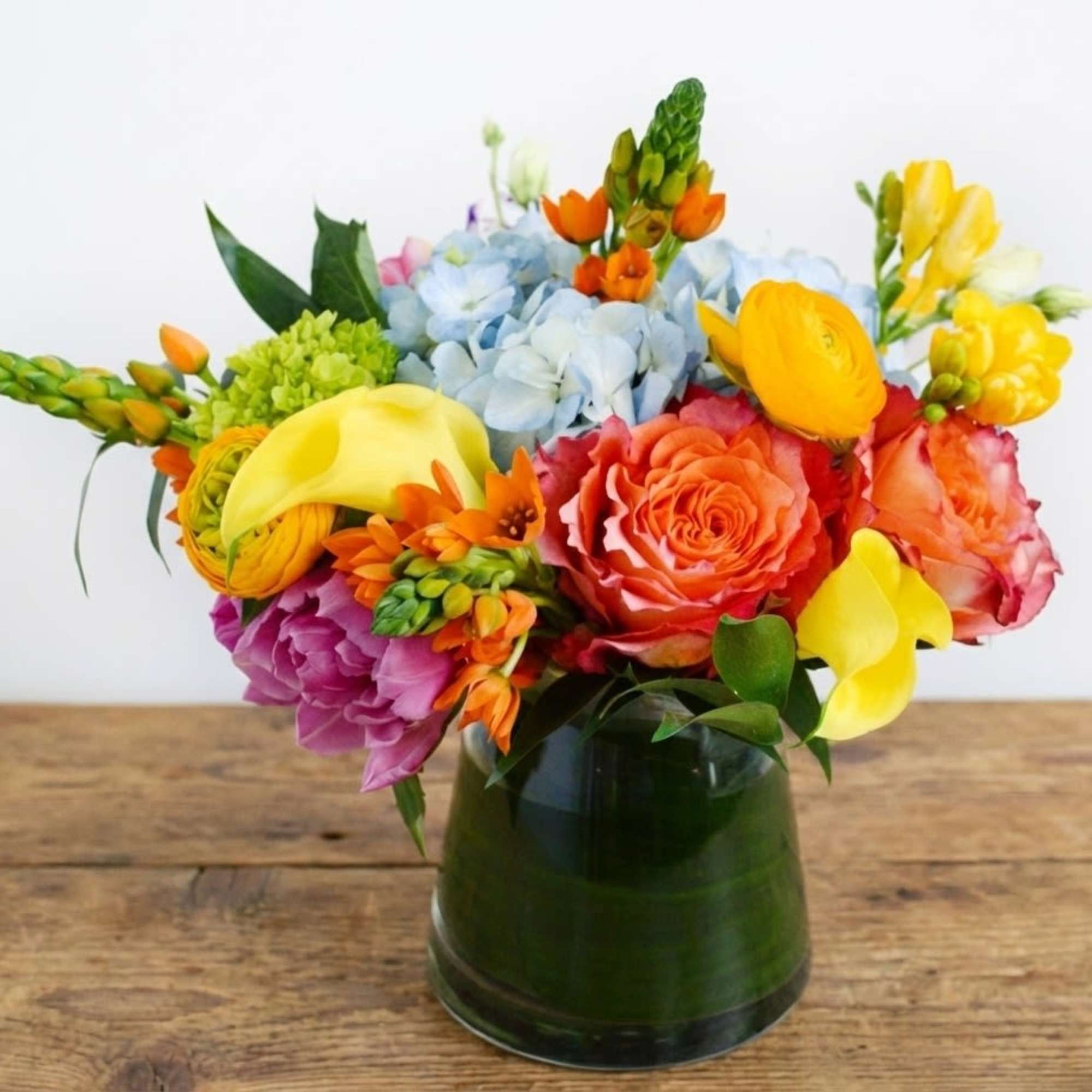 Whether for yourself or as a gift, our Warm Greetings vase arrangement