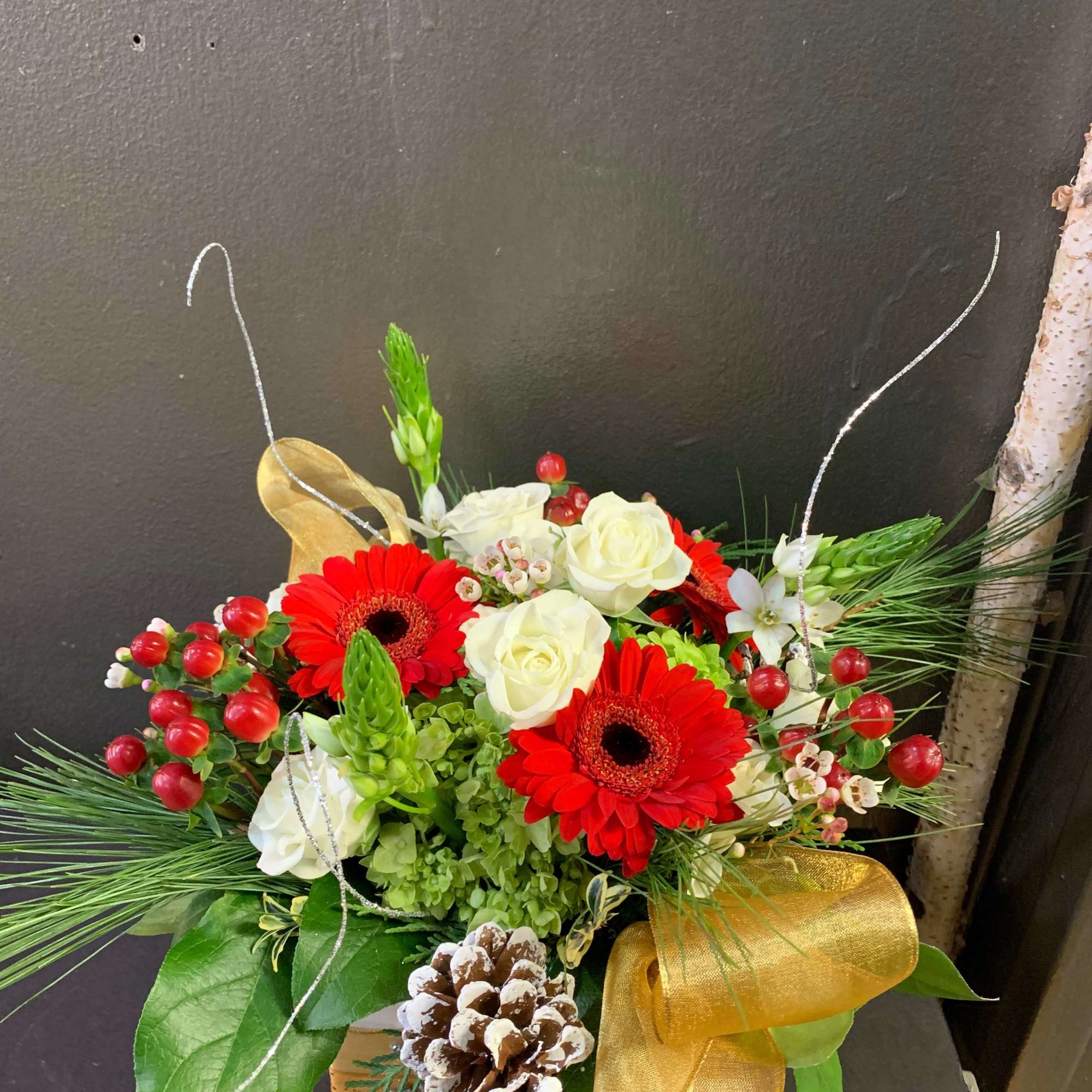 A low vase arrangement filled with festive fun for the table.