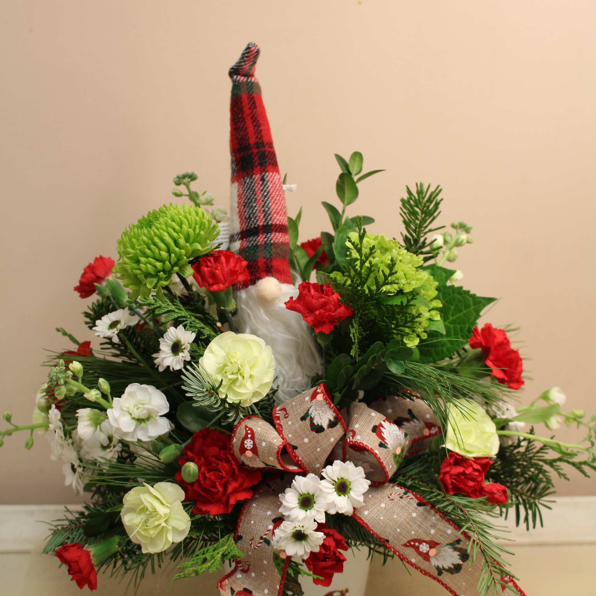 gnome themed arrangement with an ornament gnome to take out year after