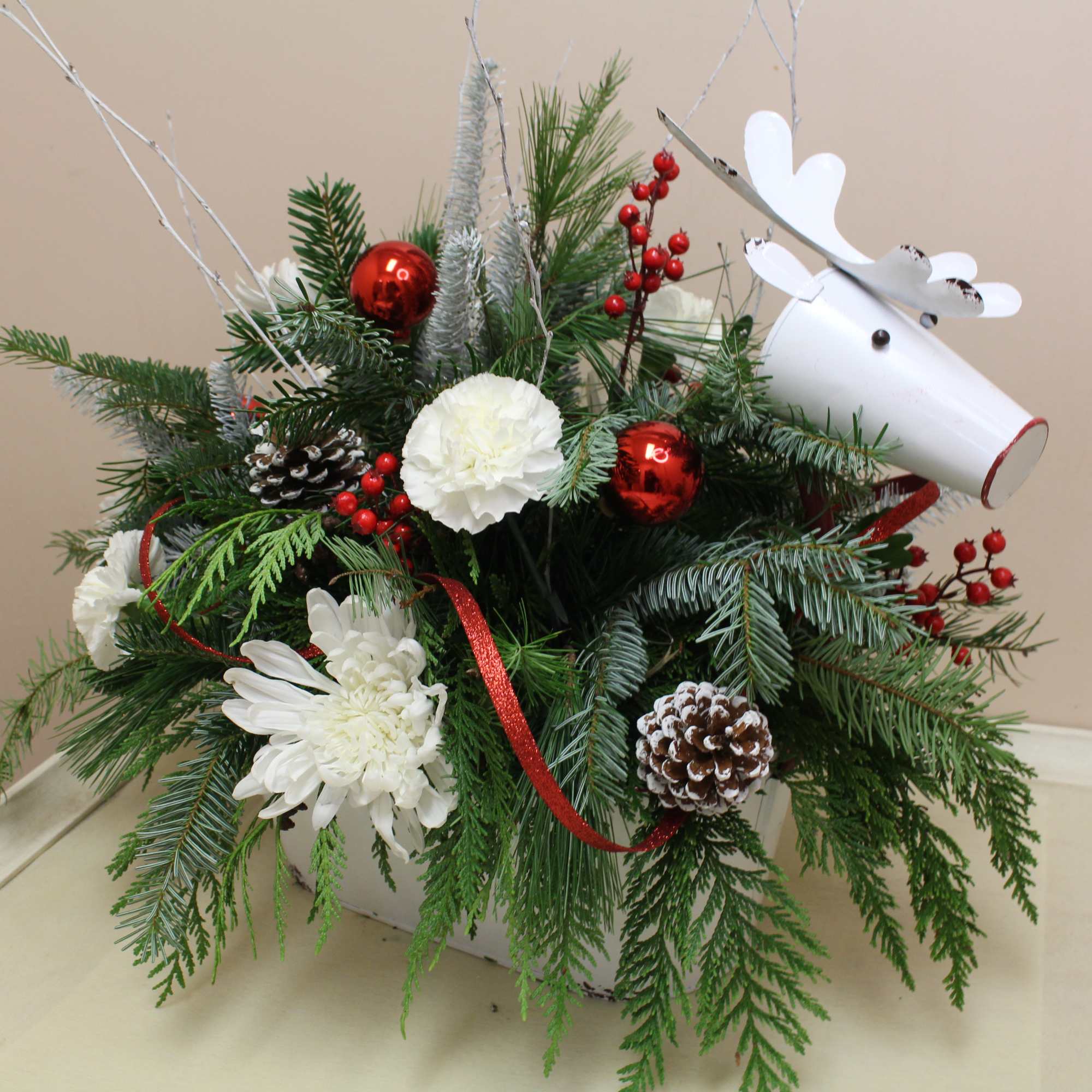 here comes Rudolph is this enamel container featuring a beautiful holiday arrangement