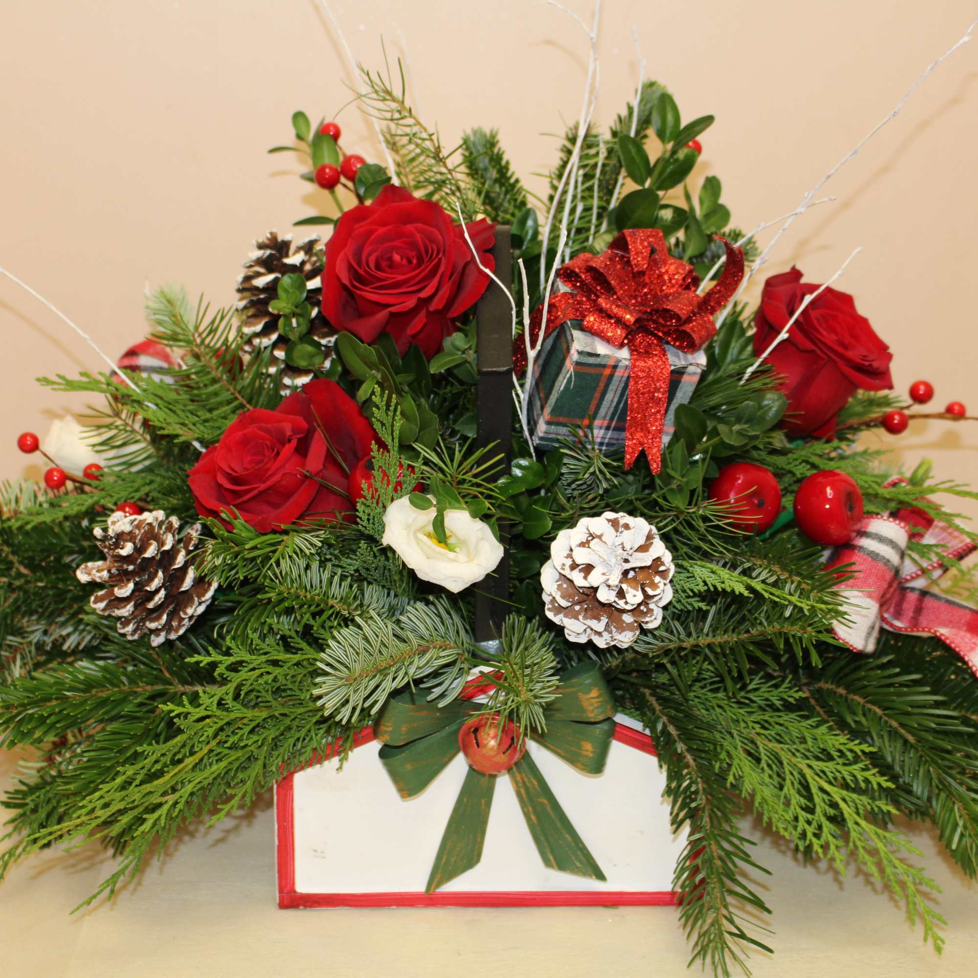 An old fashion basket with a rod iron handle is filled with