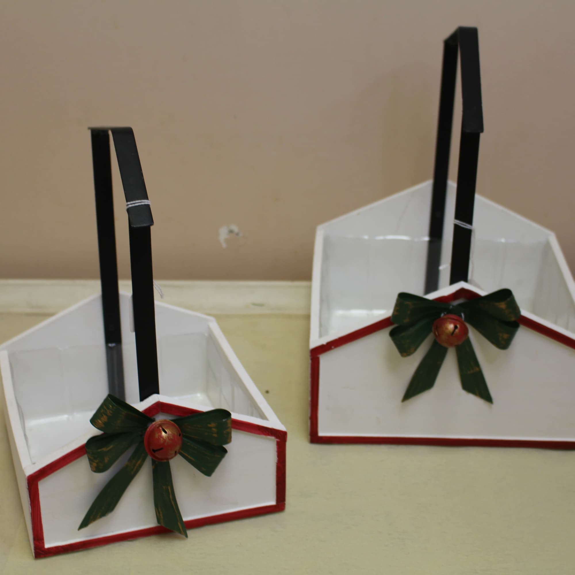 An old fashion basket with a rod iron handle is filled with