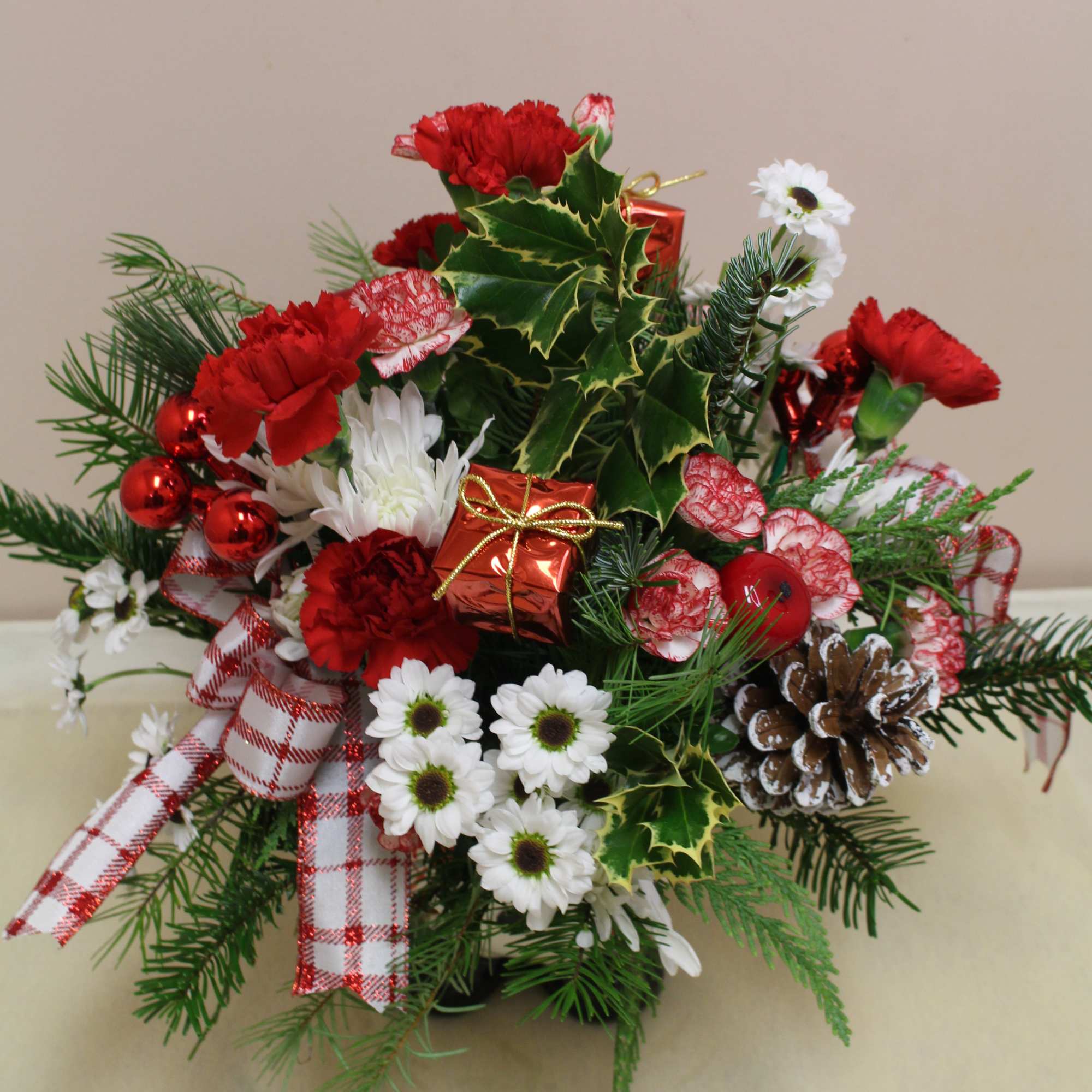a snowman bottom filled with a holiday arrangement