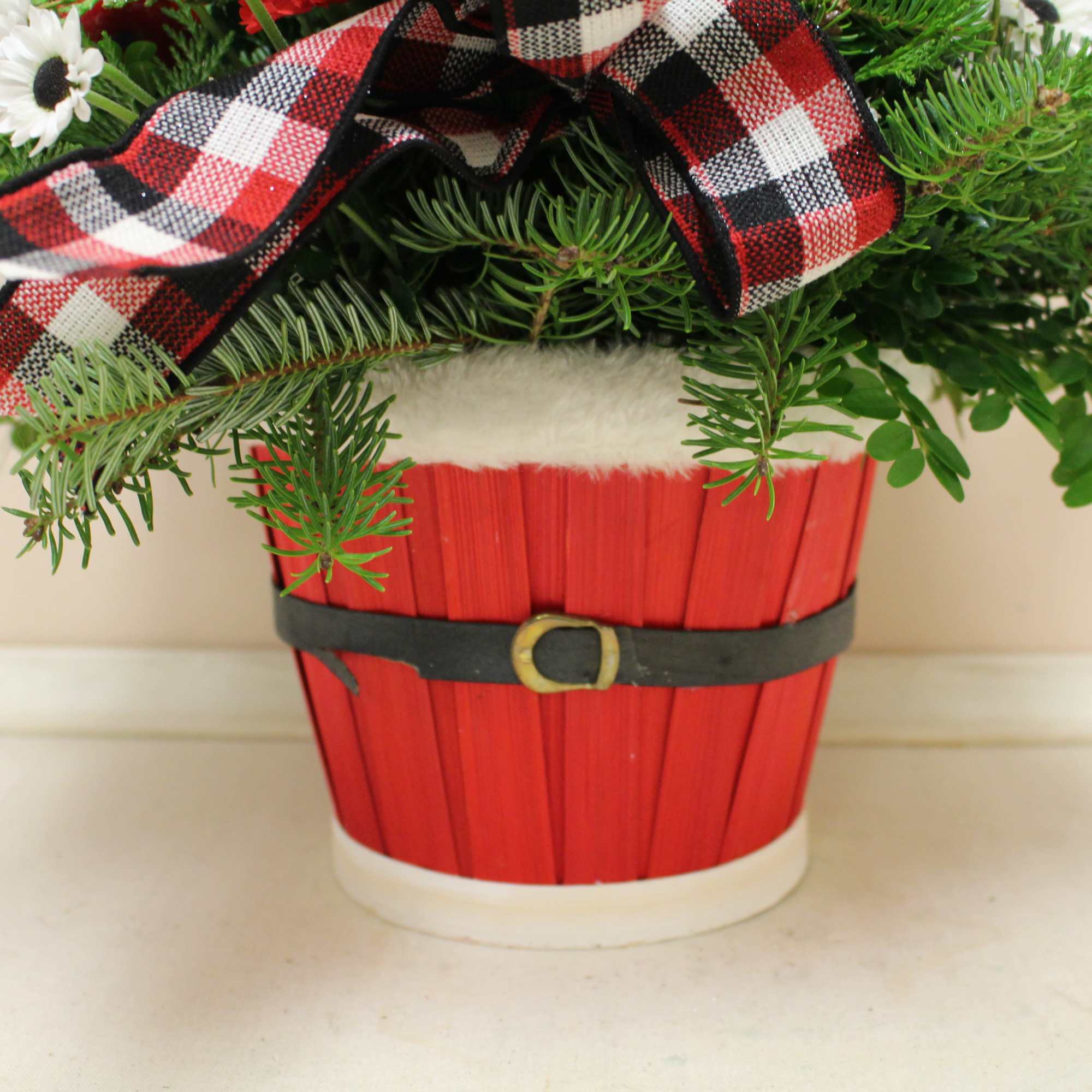 an adorable basket that looks like Santa's belly, filled with a beautiful