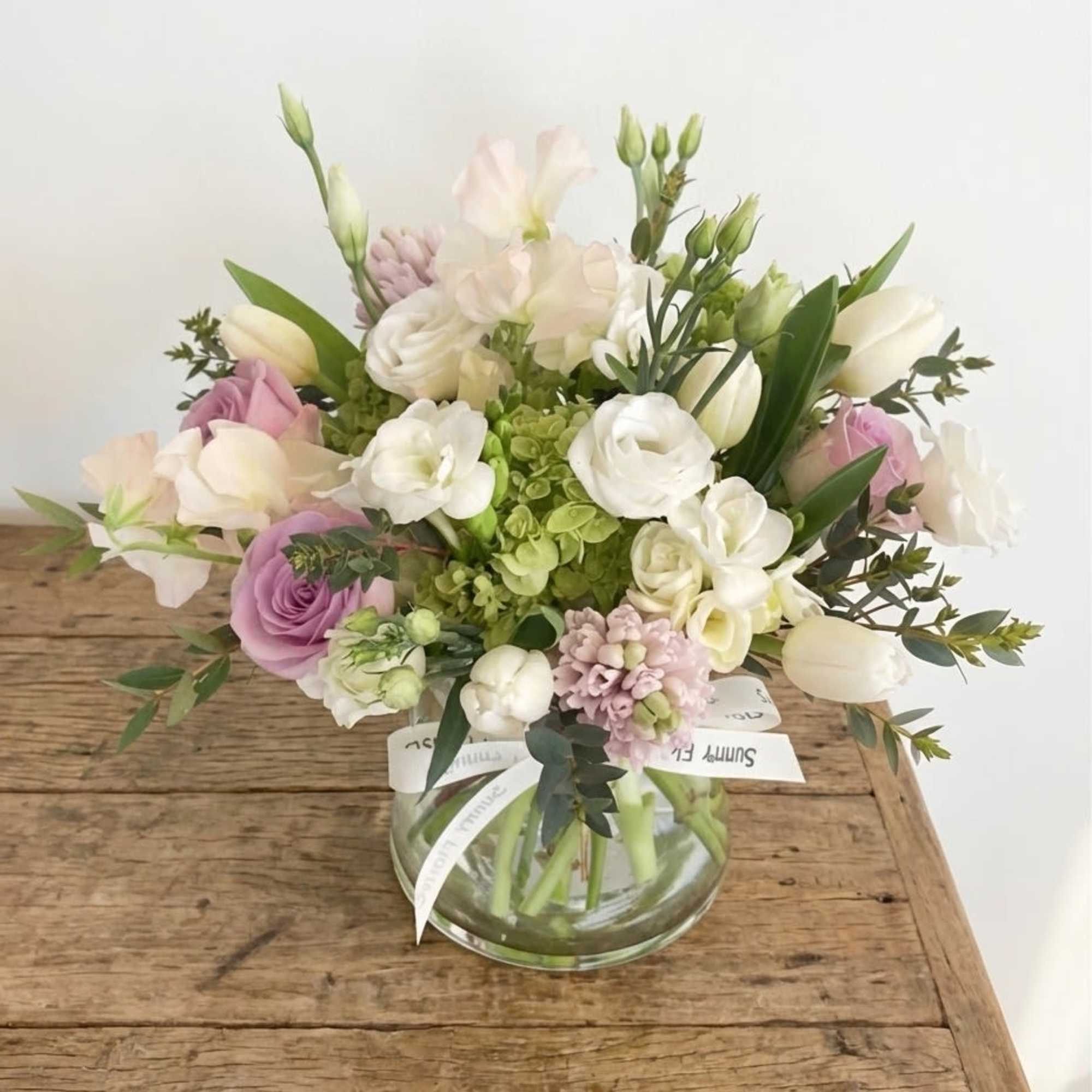 This arrangement is presented in 5.5 pinched clear glass vase. This arrangement