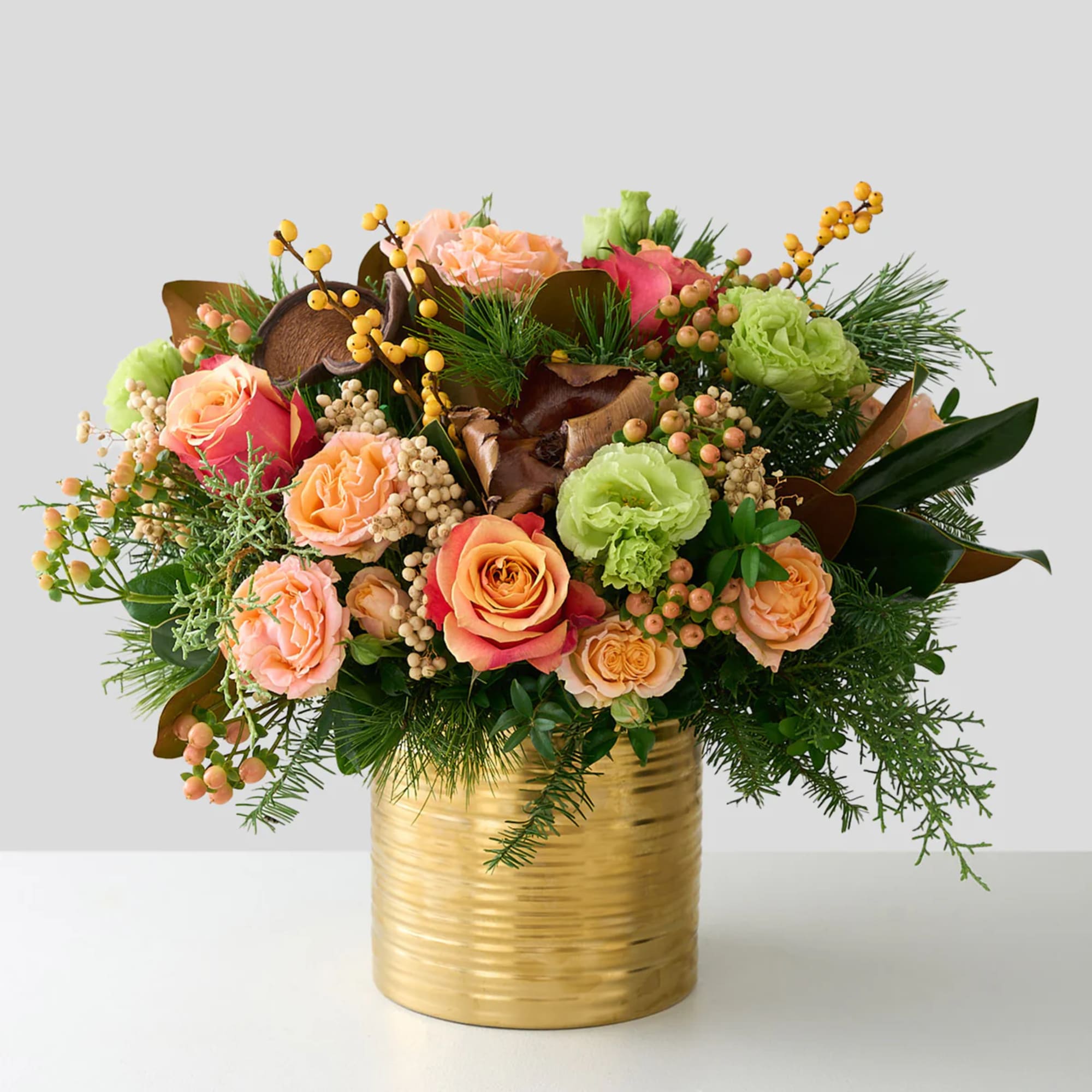 A limited edition gorgeous Winter arrangement featuring Free Spirit roses, hypericum berries