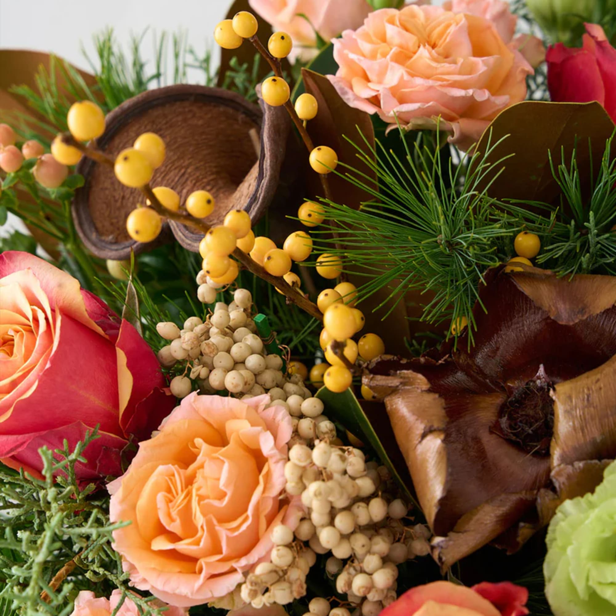A limited edition gorgeous Winter arrangement featuring Free Spirit roses, hypericum berries