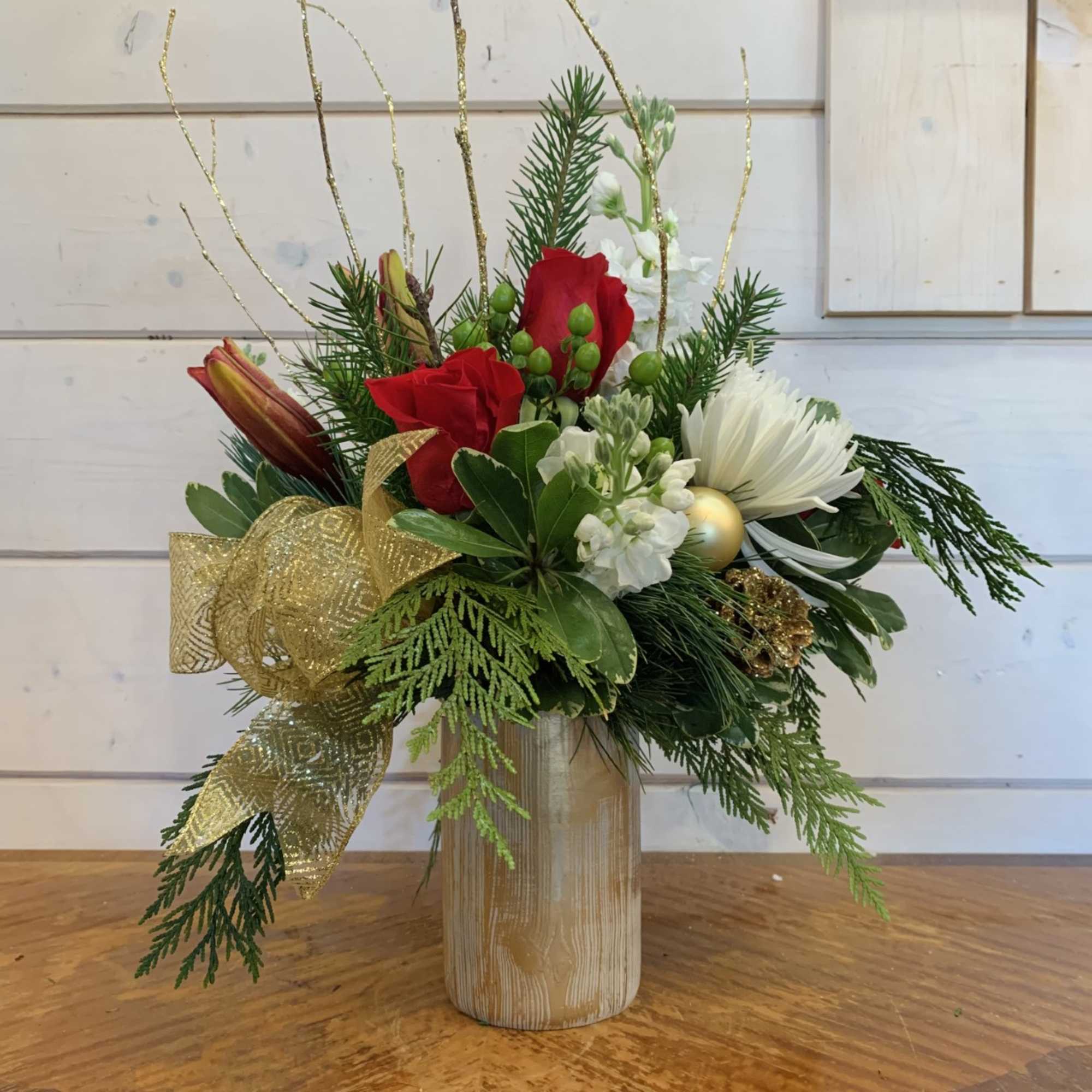 Red roses, burgundy lily, white stock, white spiders and green hypericum berries