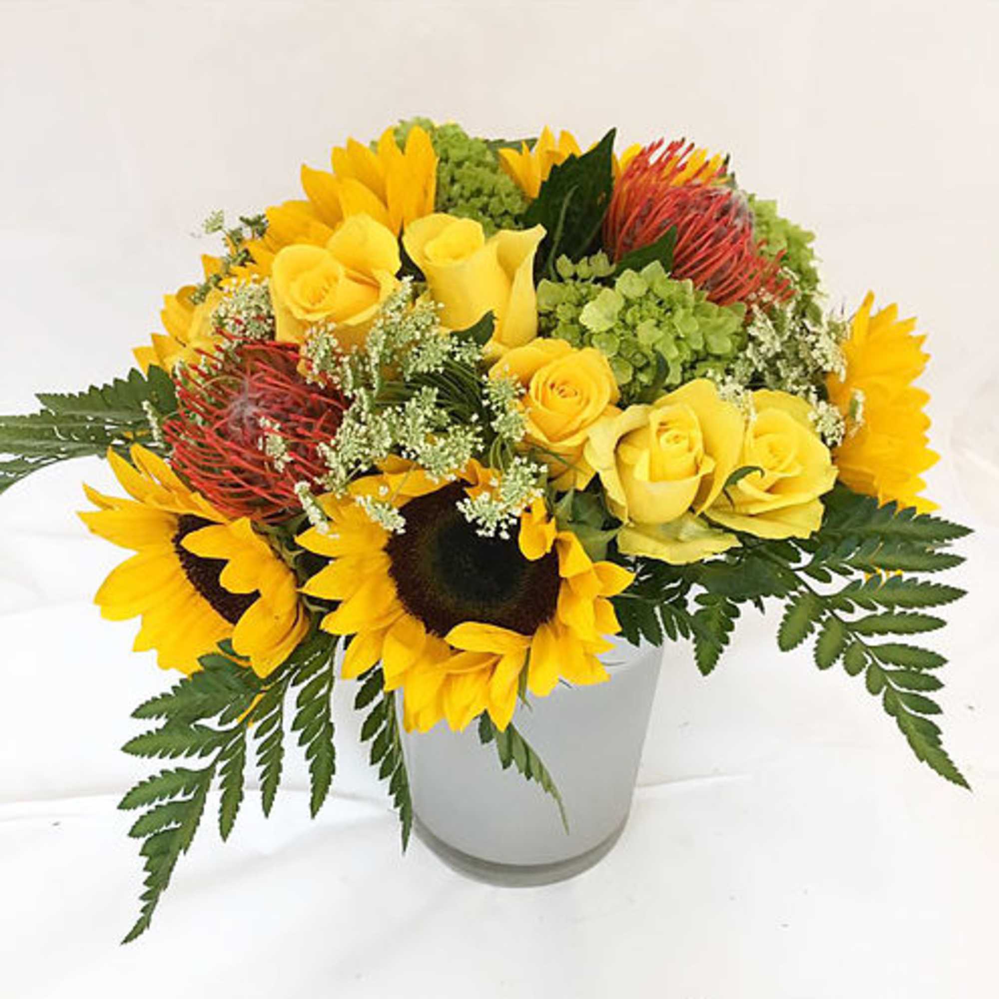 This arrangement uses yellow, green and orange to bright somebody&#039;s day. 

Size: