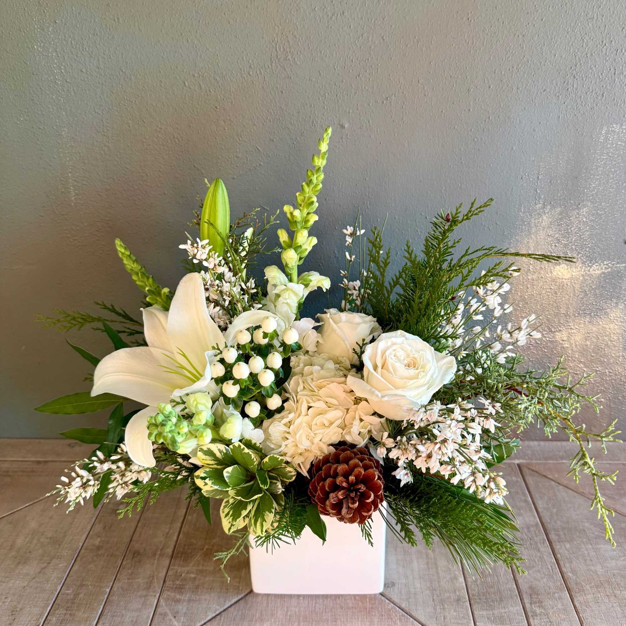 Make someone&#039;s winter day with this elegant arrangement of white florals and