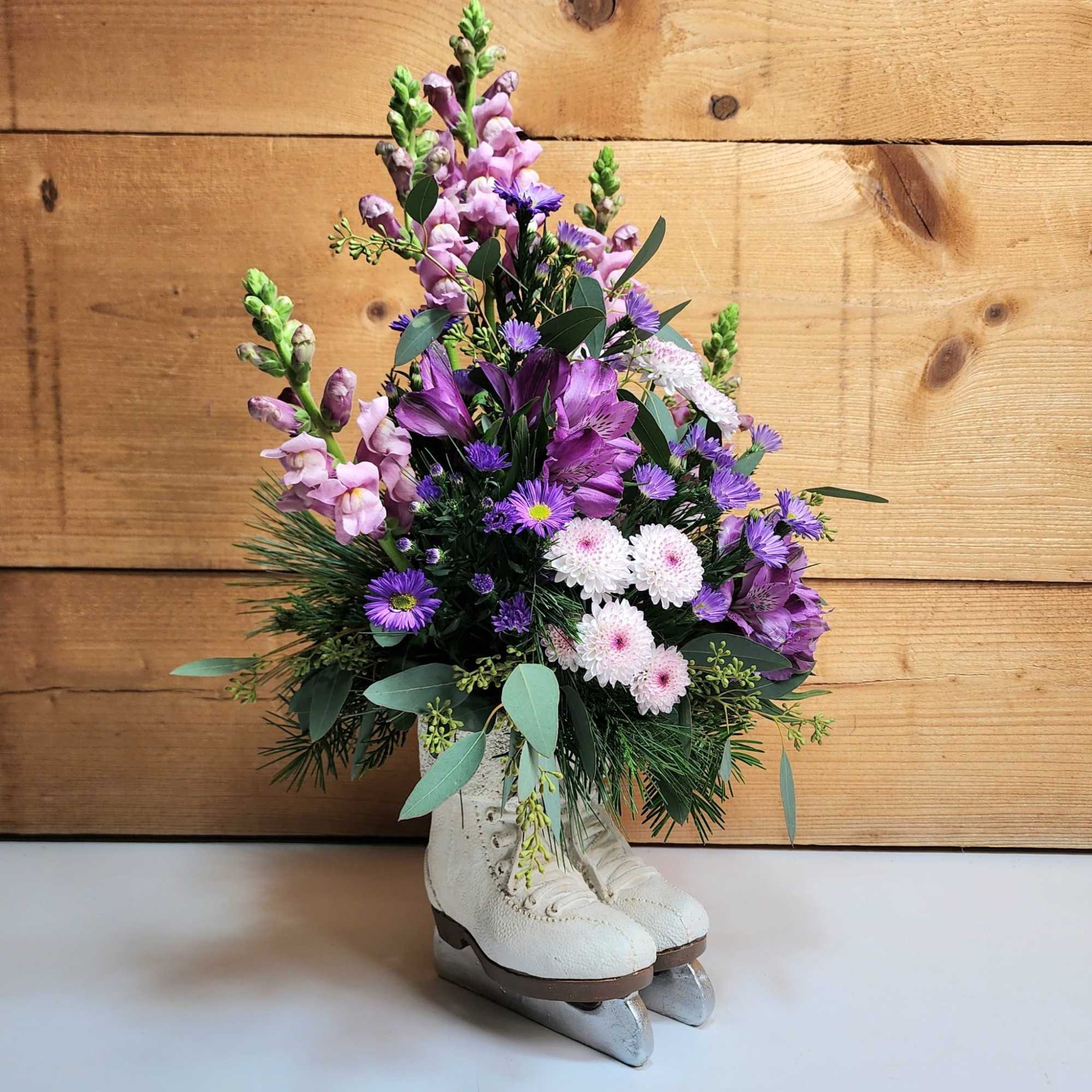 Blooms On Ice stars beautiful shades of purple flowers such as snapdragons