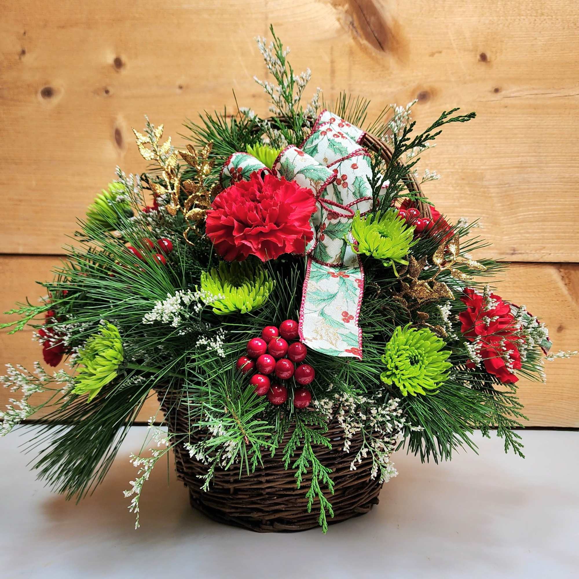 Bring on the festivities with our Holly Jolly Basket! Carnations and pom