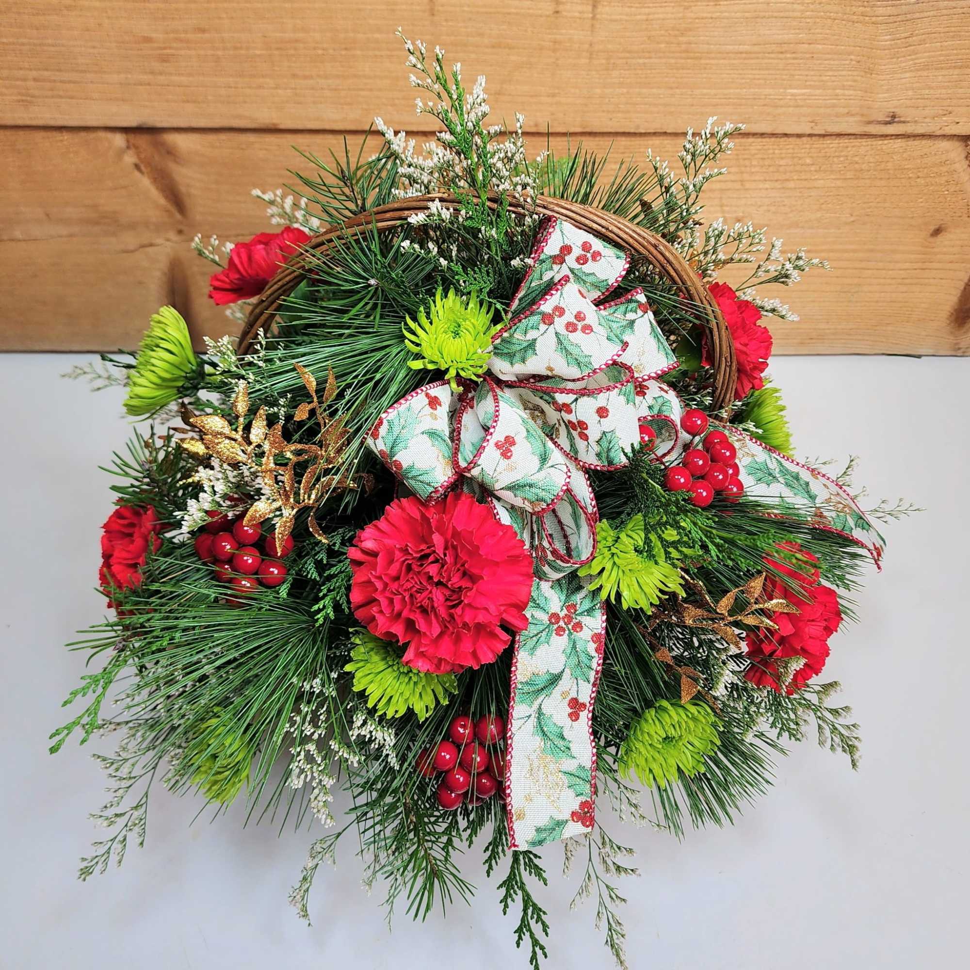 Bring on the festivities with our Holly Jolly Basket! Carnations and pom