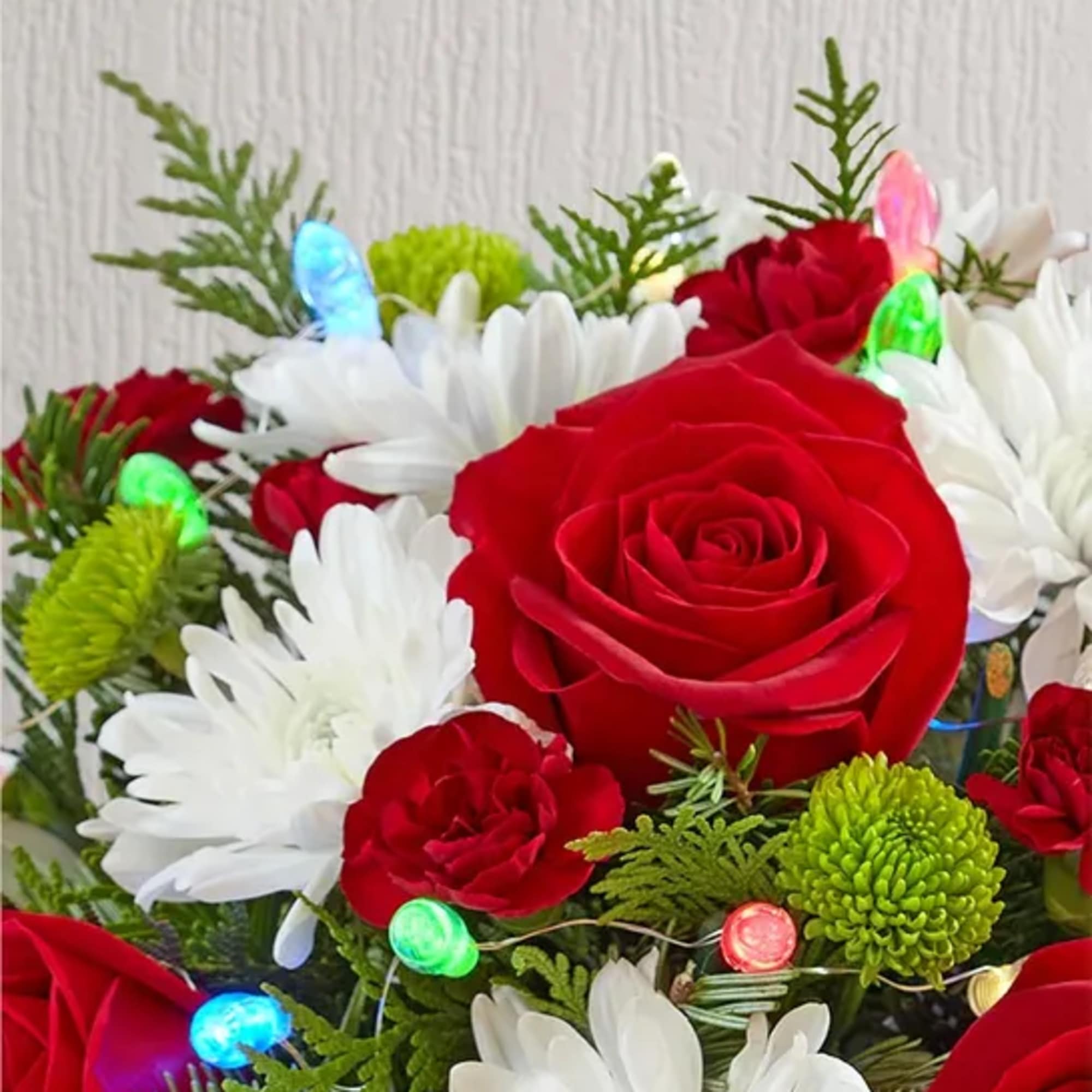 Send holiday joy their way! Our dashing arrangement is filled with classic