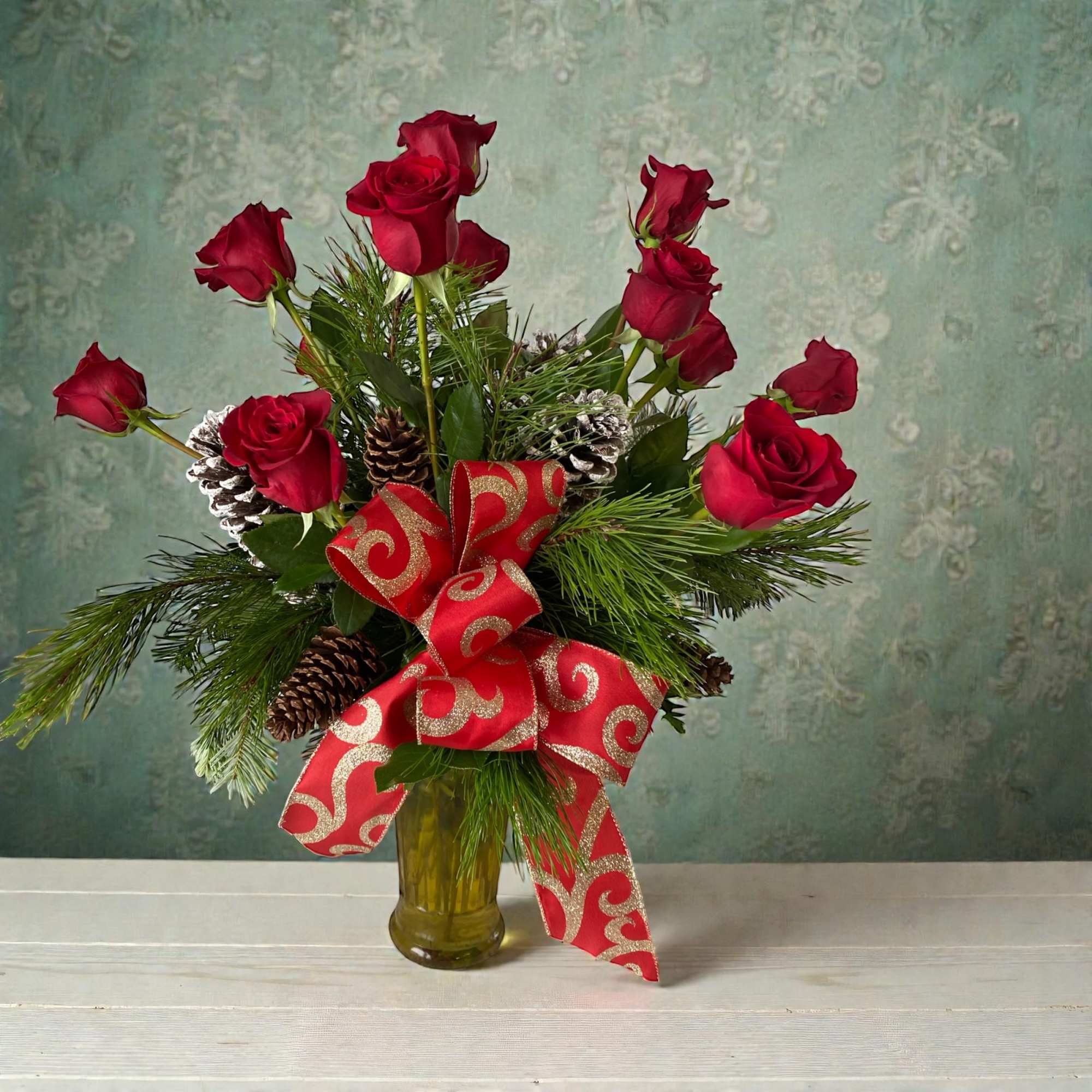 Send the magic of the season with one dozen classic red roses