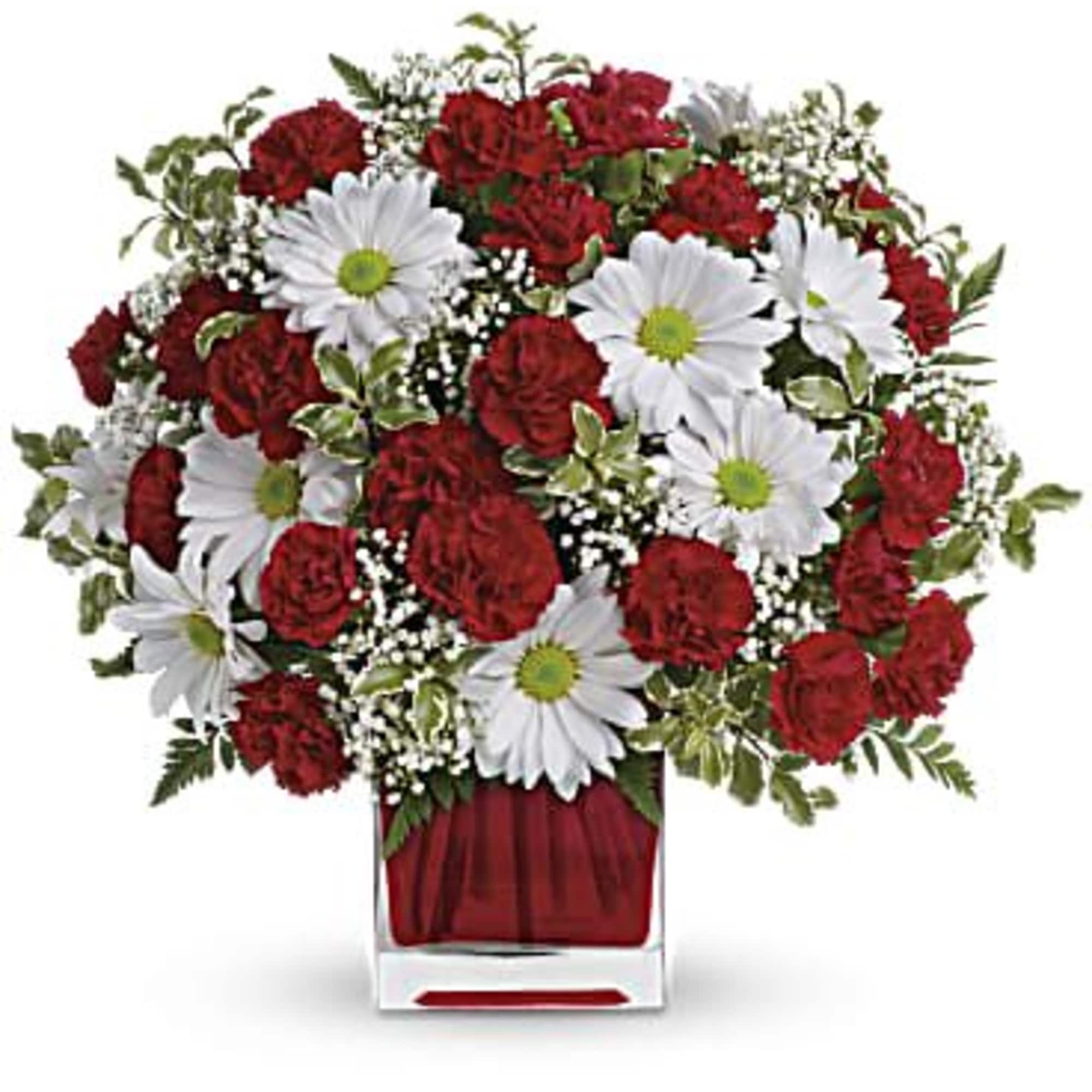 This simply sweet bouquet is delicately arranged in our ruby red glass