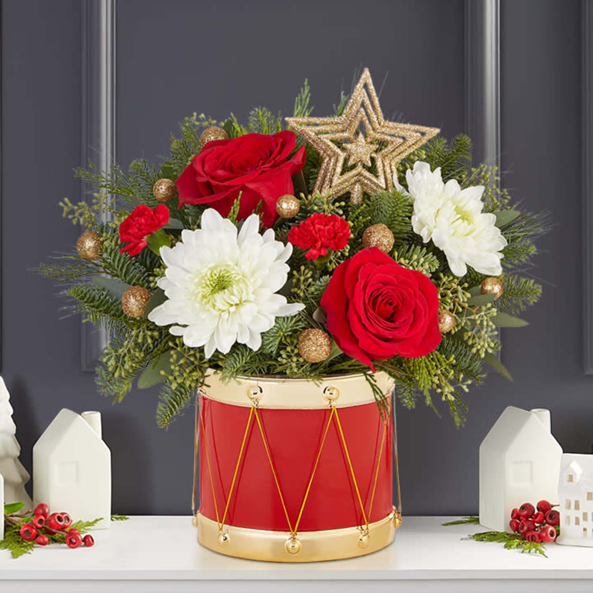 The joy of gift-giving comes alive in our bright and festive arrangement.