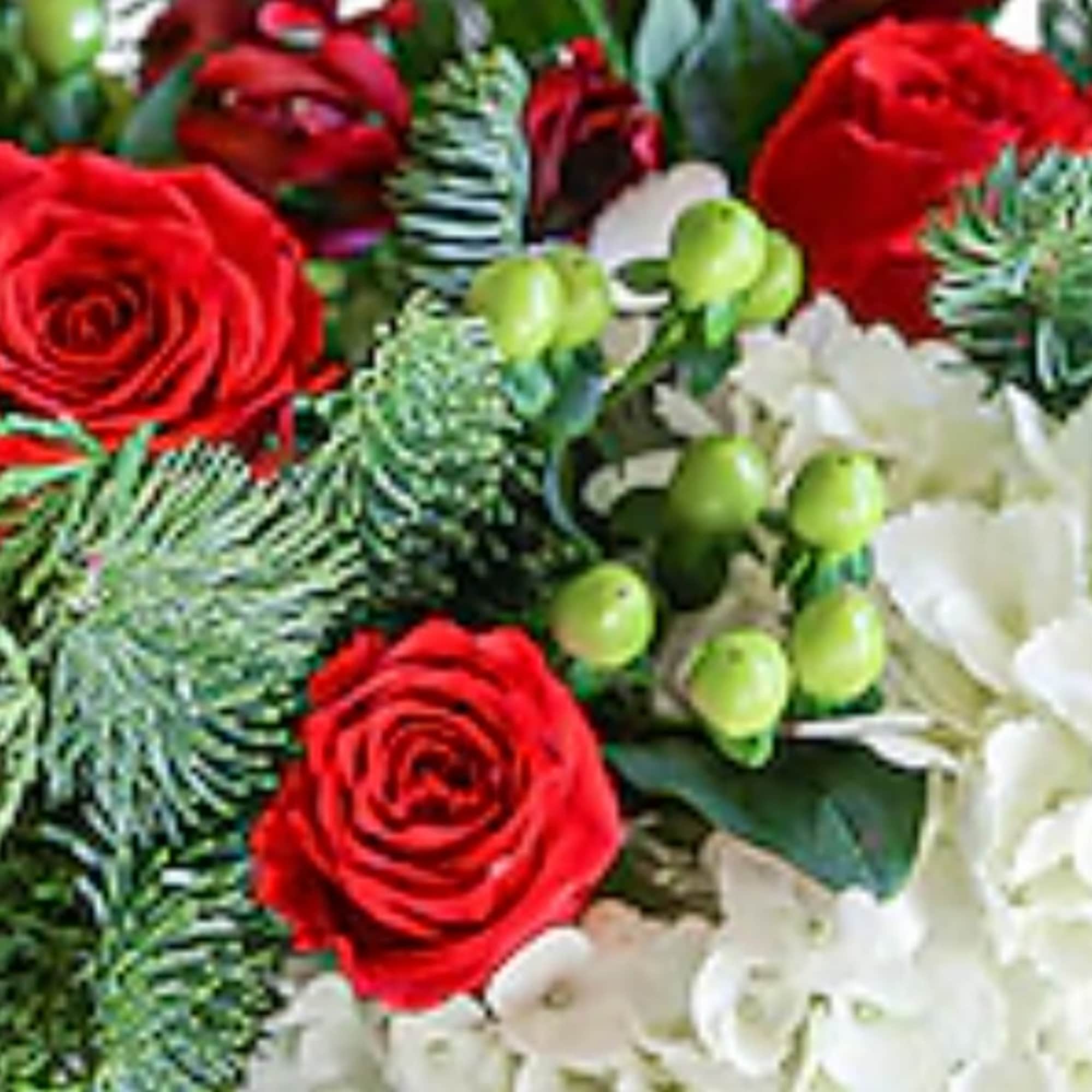 A beautiful crisp bouquet of red, white &amp; green blooms with lush