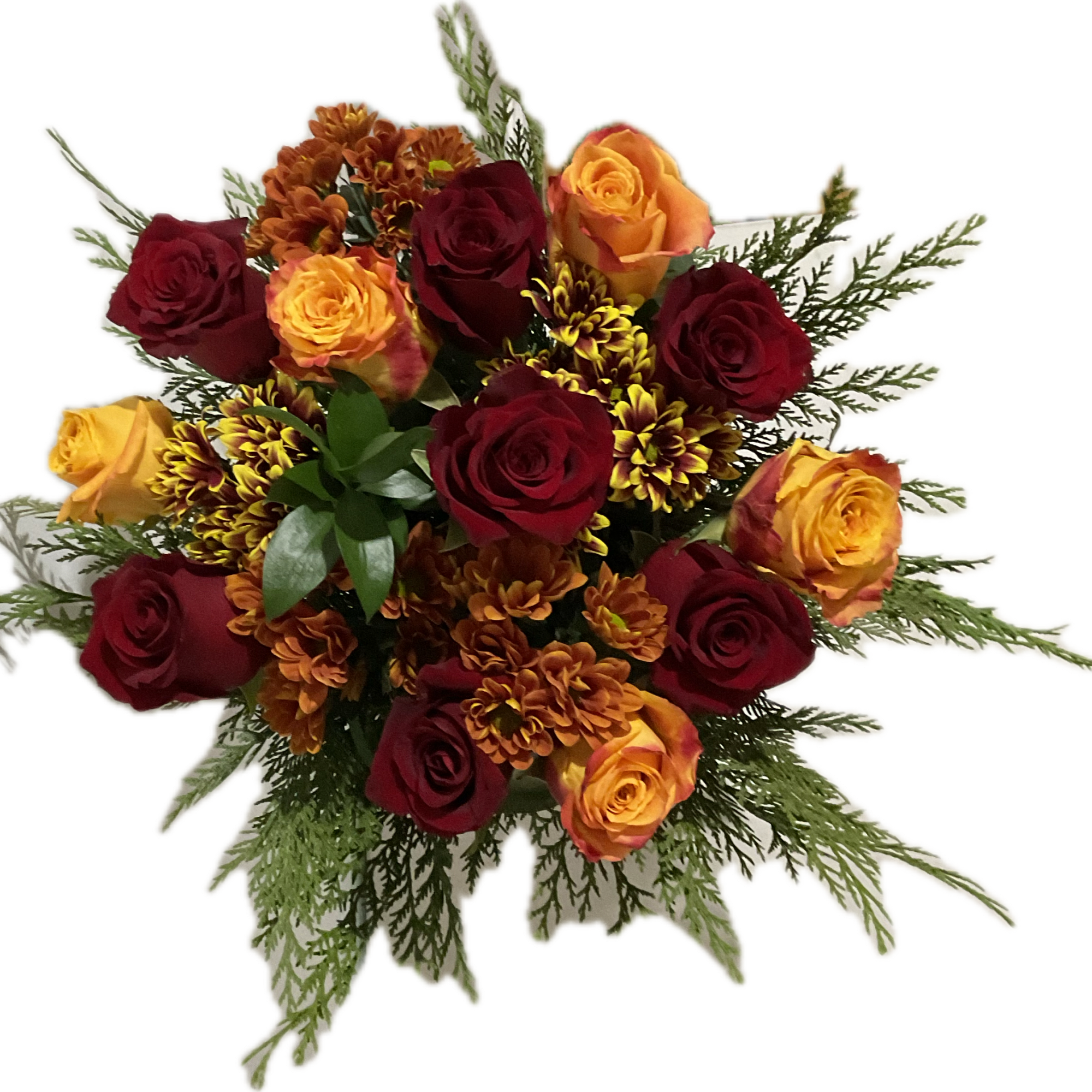 This arrangement includes red roses orange roses ,daisies, light brown and green