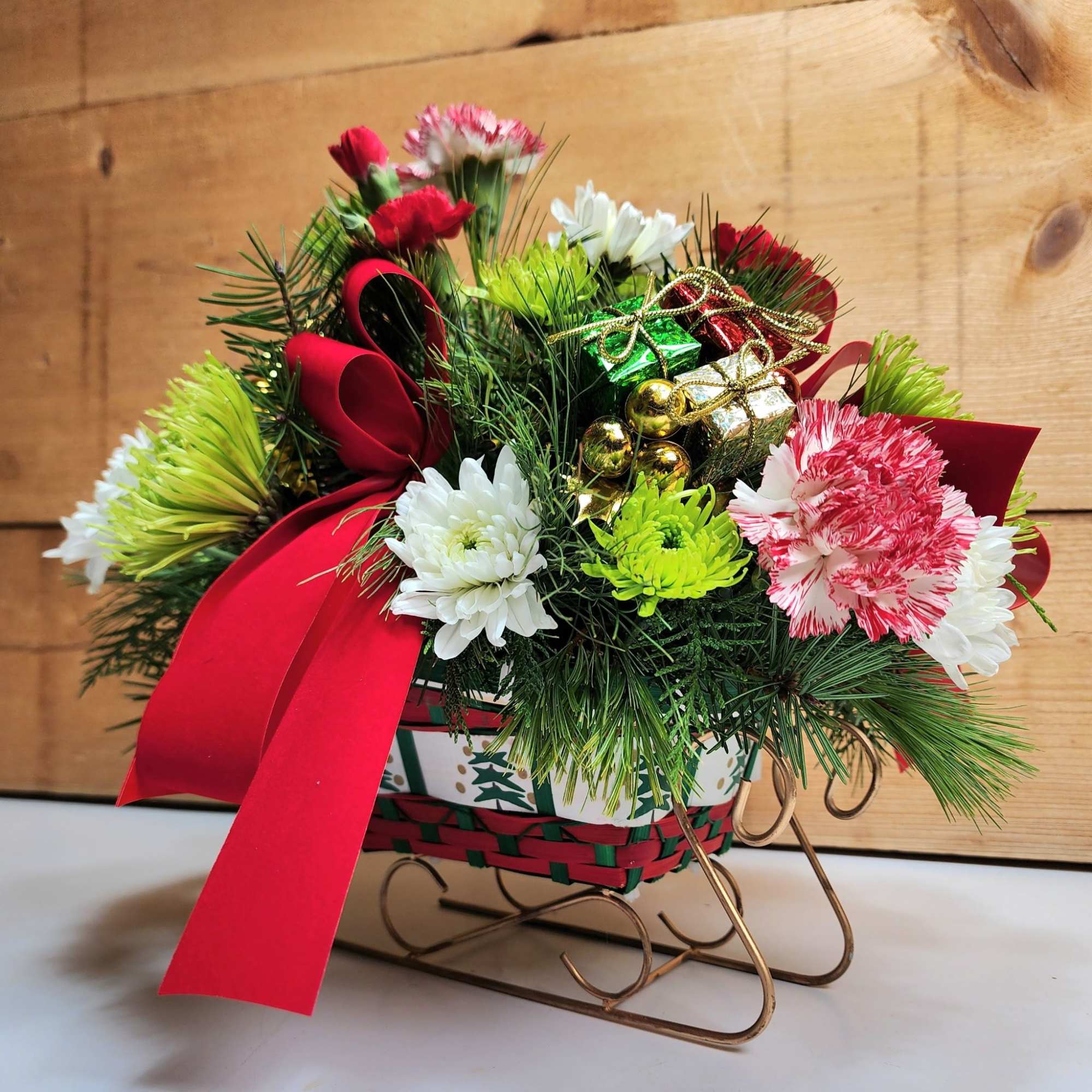 Our Joyful Sleigh Bouquet is ready to delight! With peppermint carnations, pom