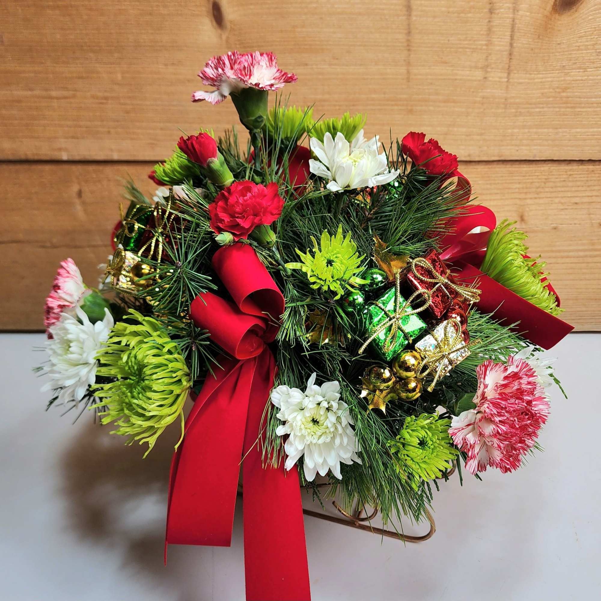 Our Joyful Sleigh Bouquet is ready to delight! With peppermint carnations, pom