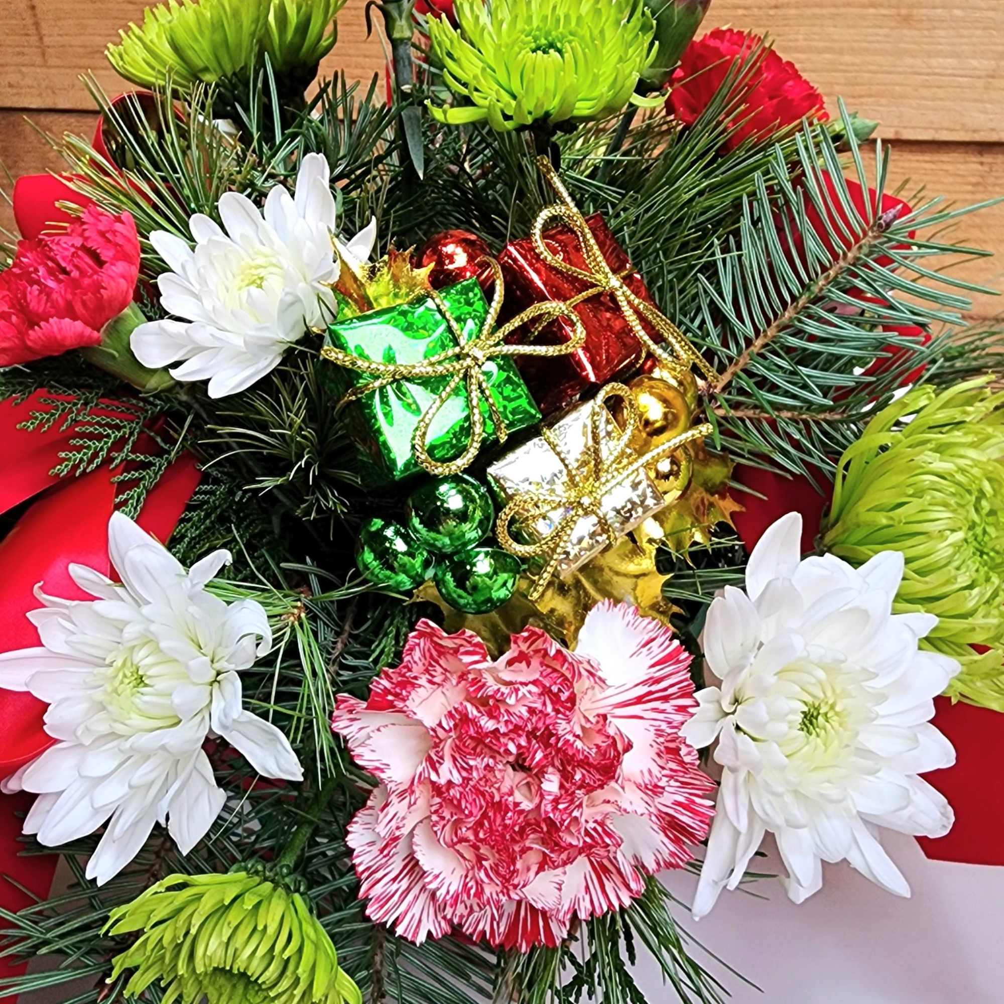 Our Joyful Sleigh Bouquet is ready to delight! With peppermint carnations, pom