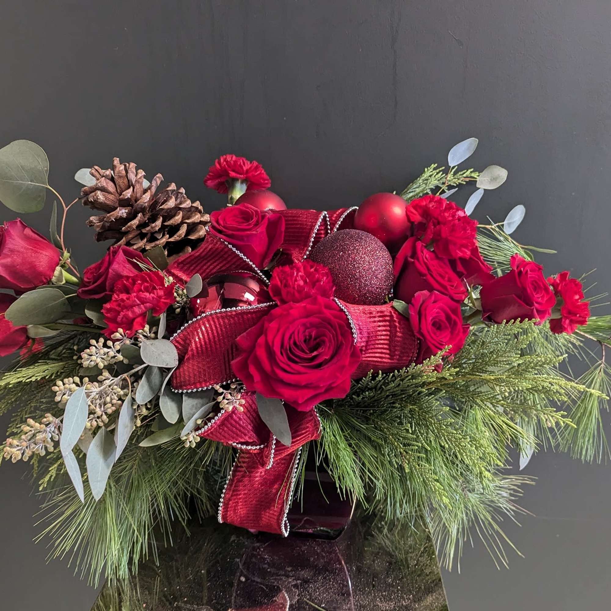 Red Holiday Centerpiece Deluxe in Midland, MI | Hannah's Flowers