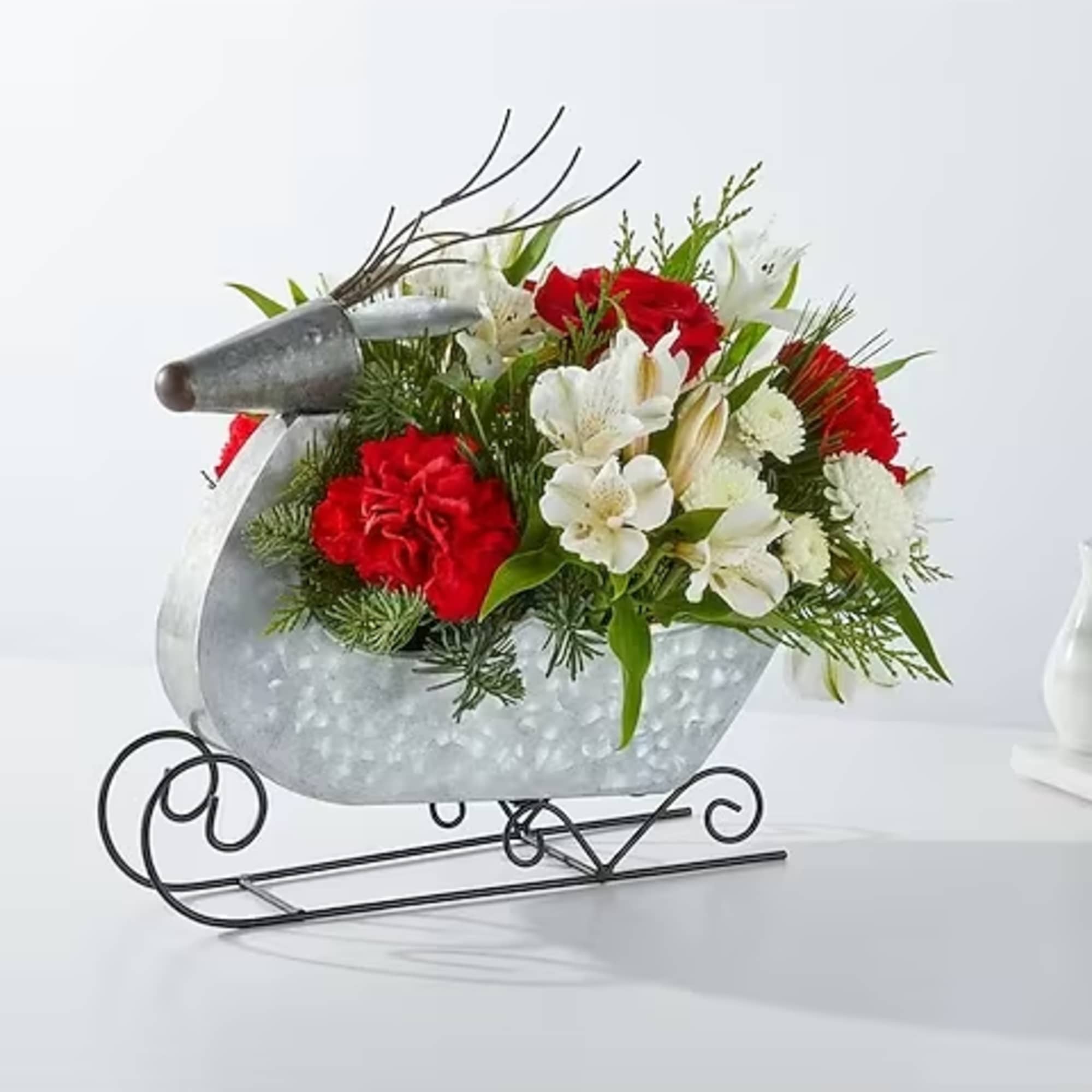 Fly into Christmas Eve with this dashing bouquet designed in a reindeer
