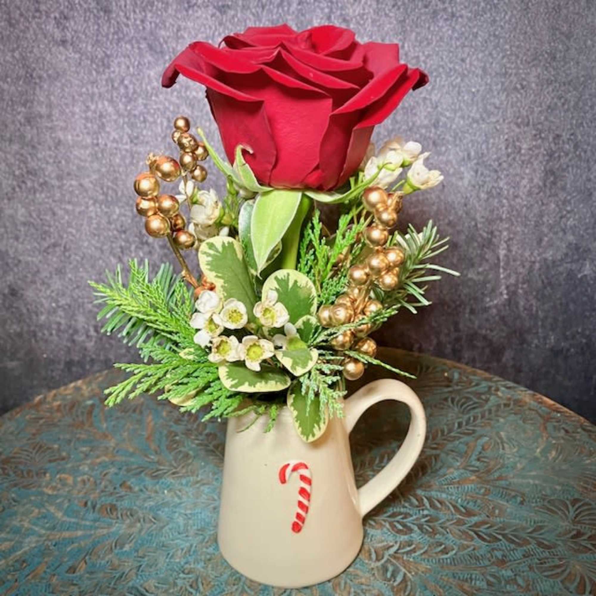 This sweet and petite arrangement makes the perfect gift to bring a