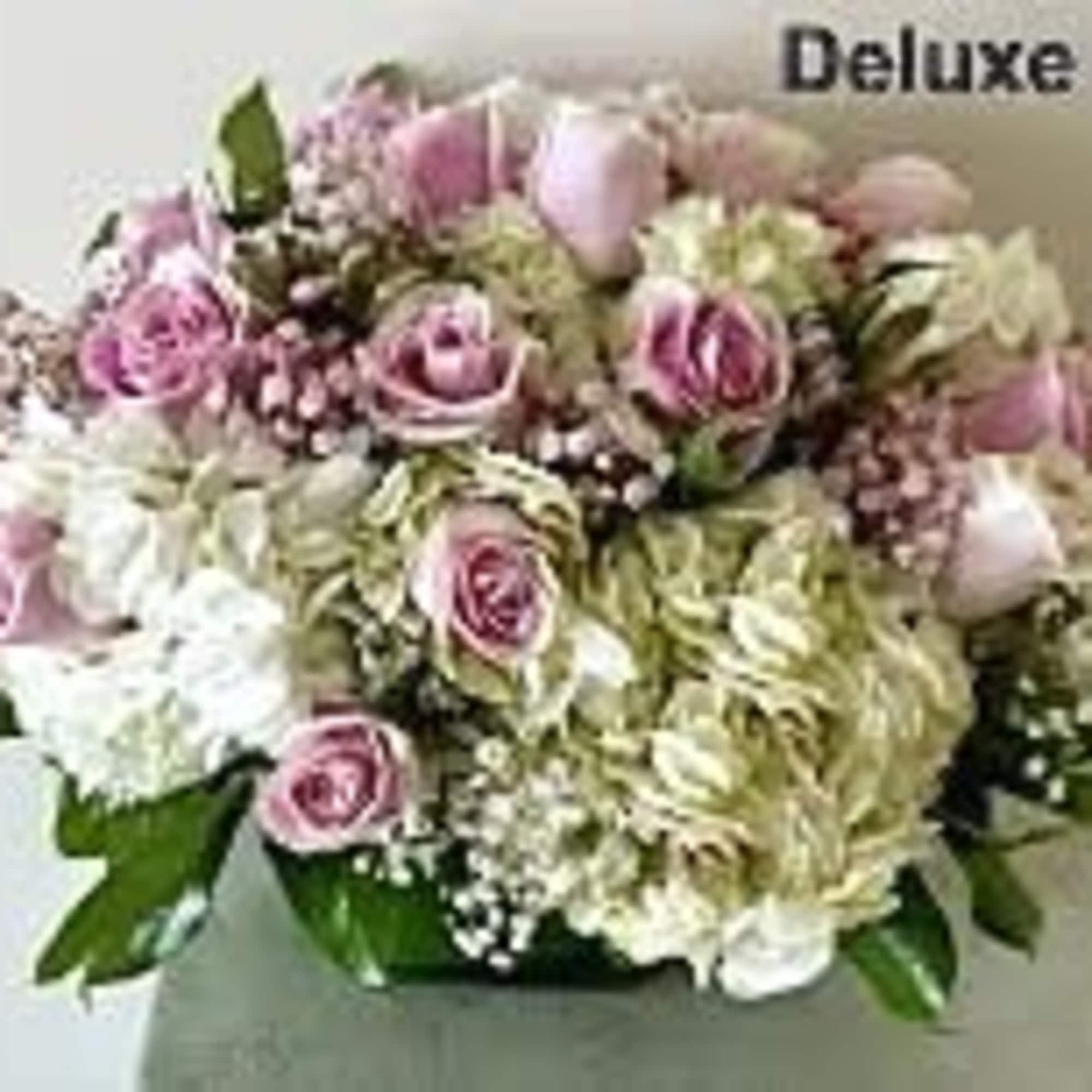 Pink Roses with White Hydrangeas arranged in a square glass vase.