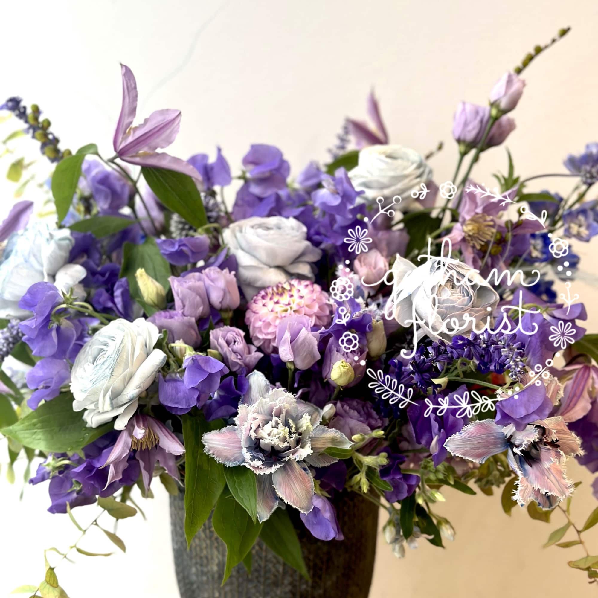 Our enchanting Whimsical Design, brimming with an exquisite selection of seasonal flowers.