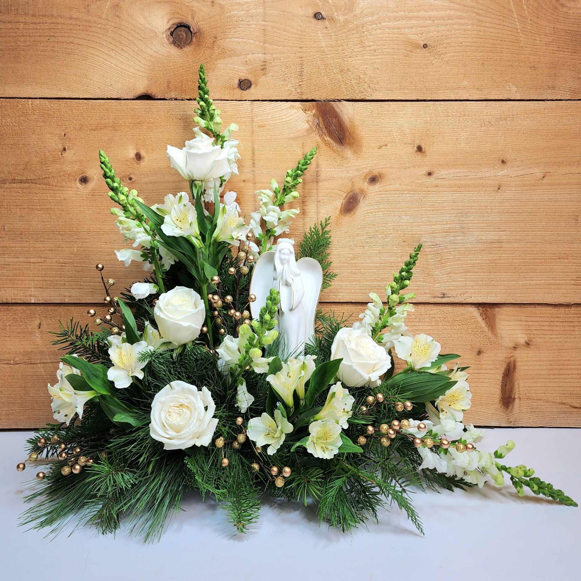 The Heavenly Peace Arrangement is a gorgeous design of white blooms including