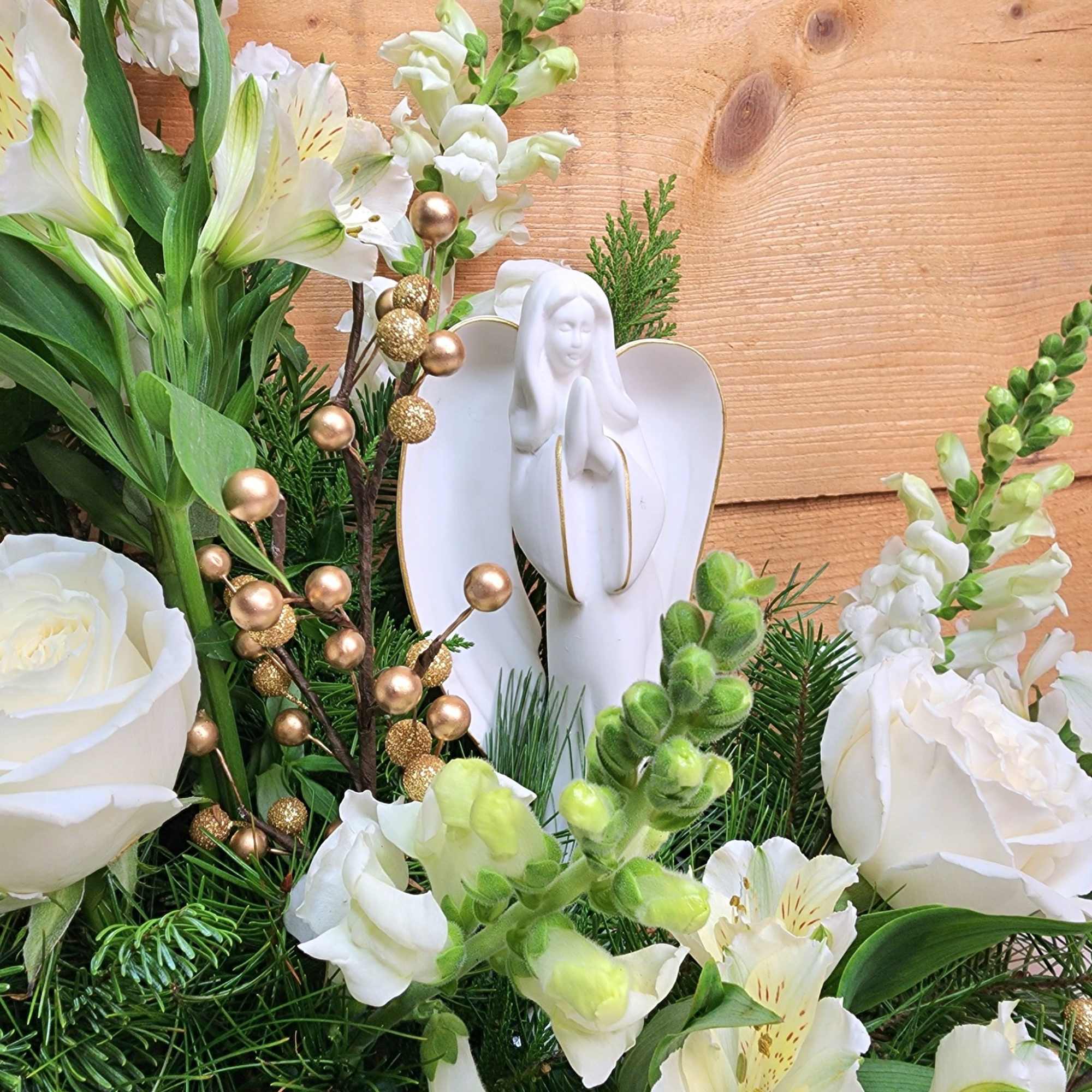 The Heavenly Peace Arrangement is a gorgeous design of white blooms including