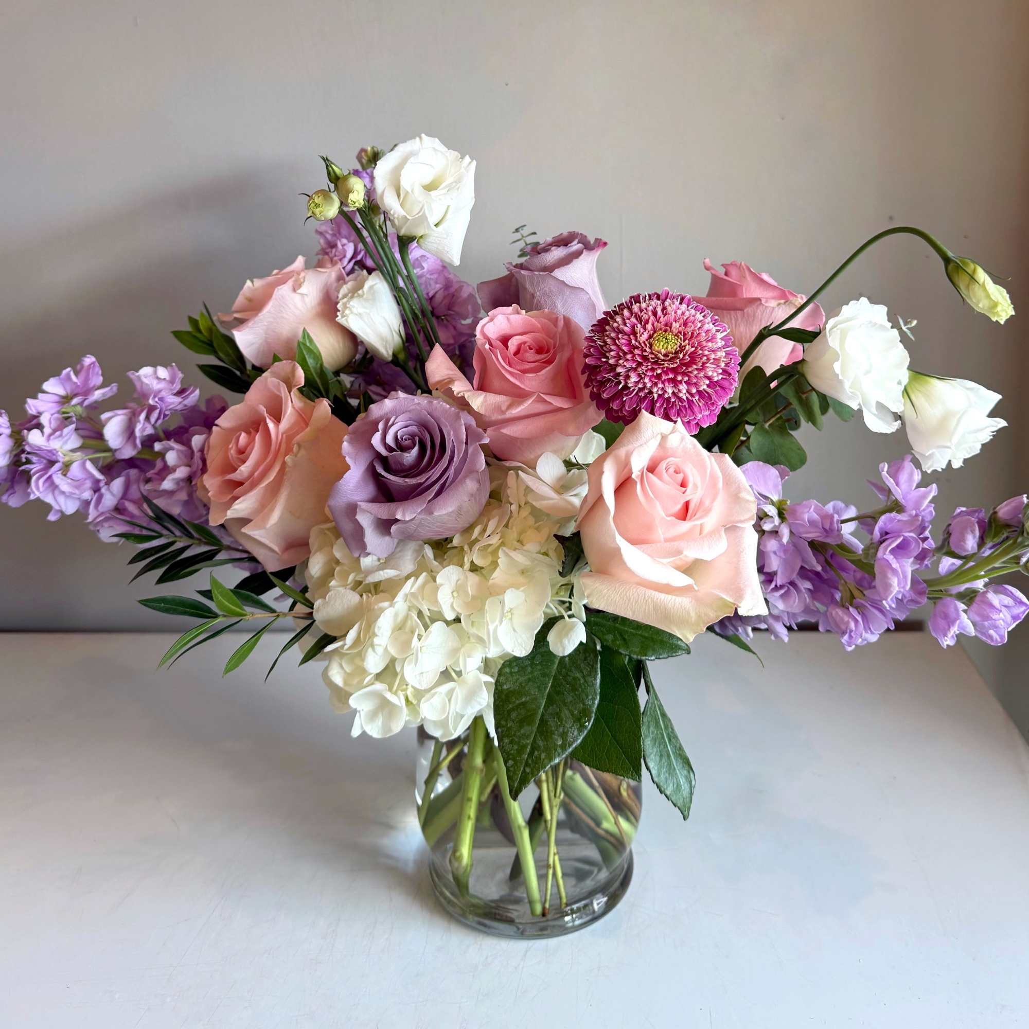 Linnea is a soft yet cheerful gathering of blush pink roses, hydrangeas