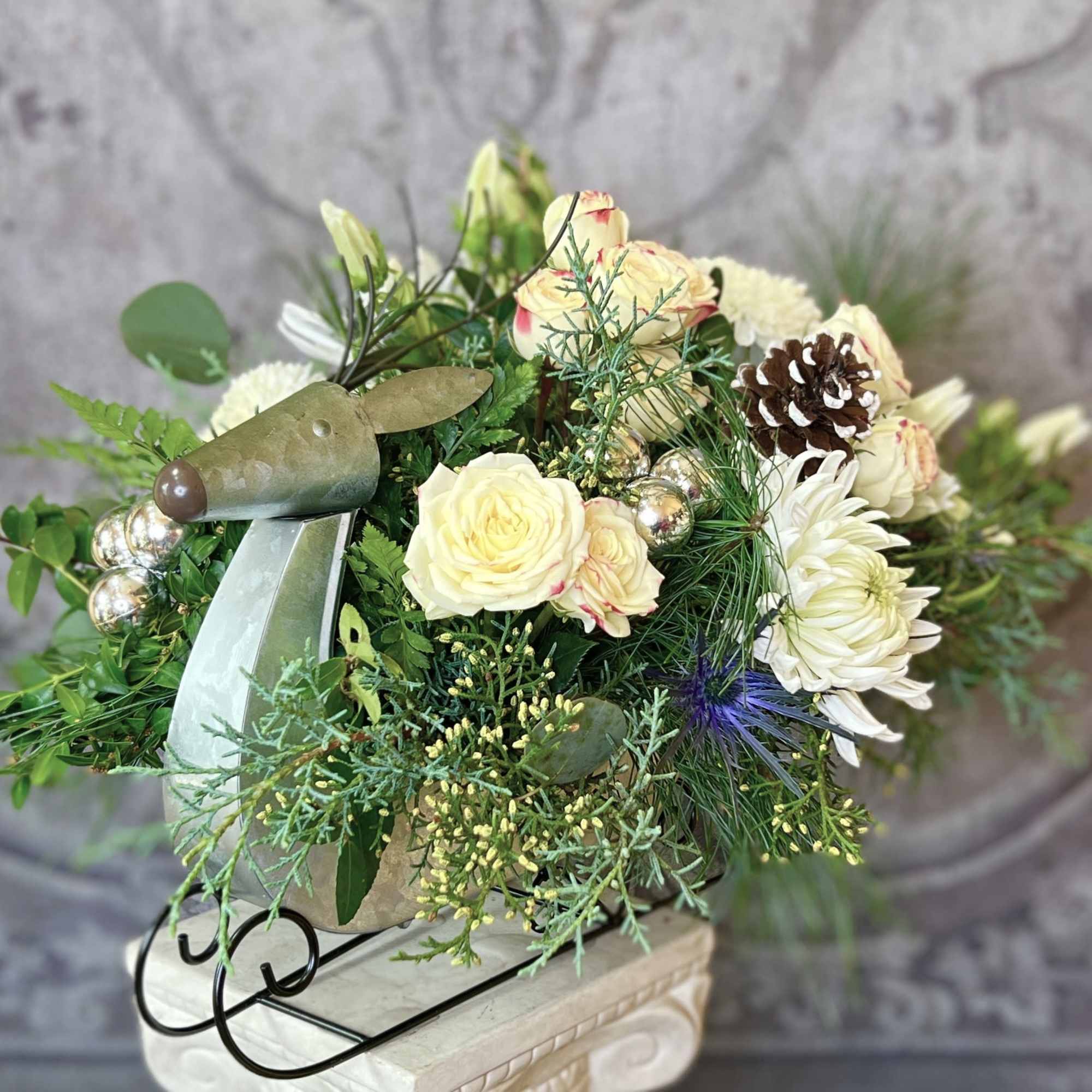 This beautiful arrangement in Green &amp; White comes in a cool Reindeer