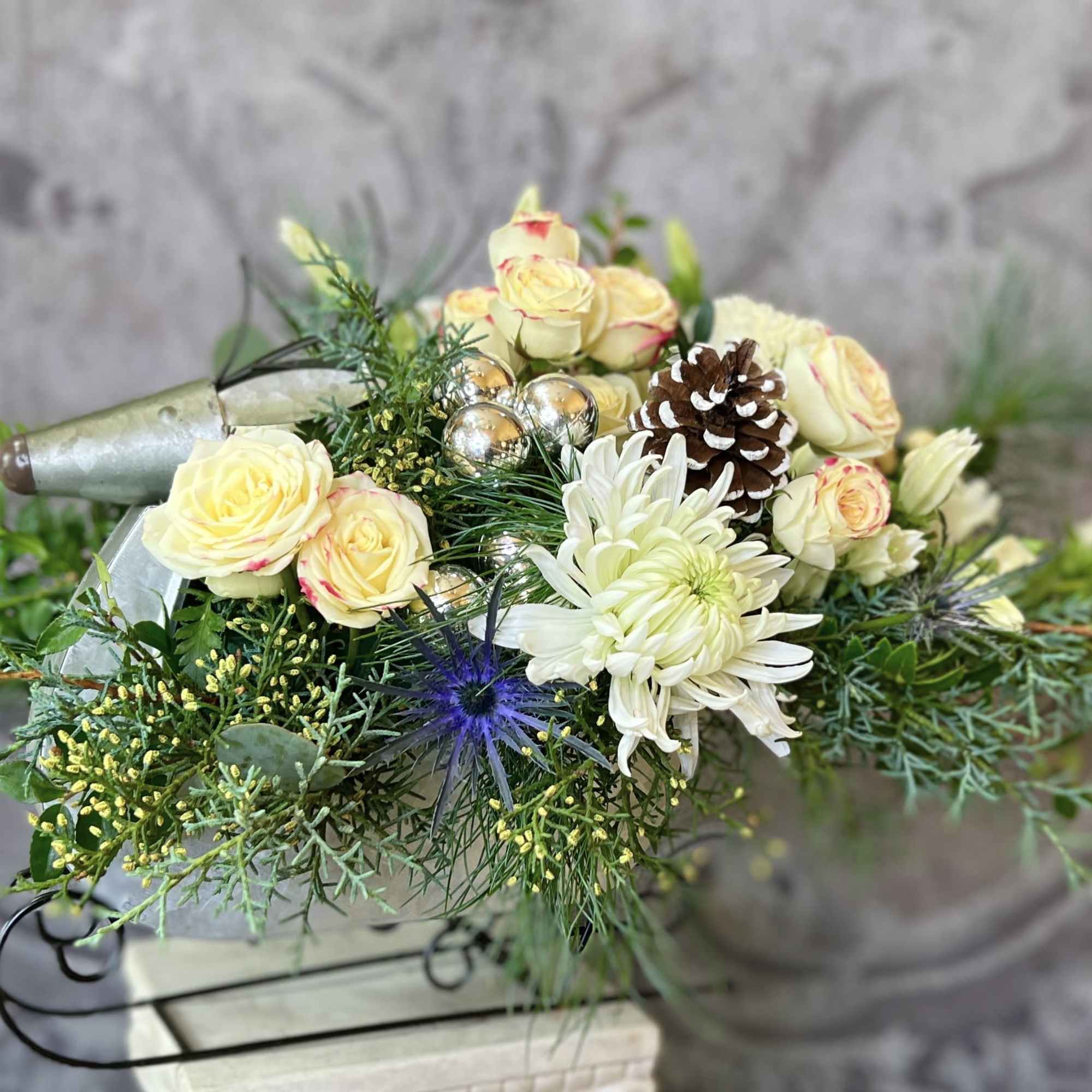 This beautiful arrangement in Green &amp; White comes in a cool Reindeer