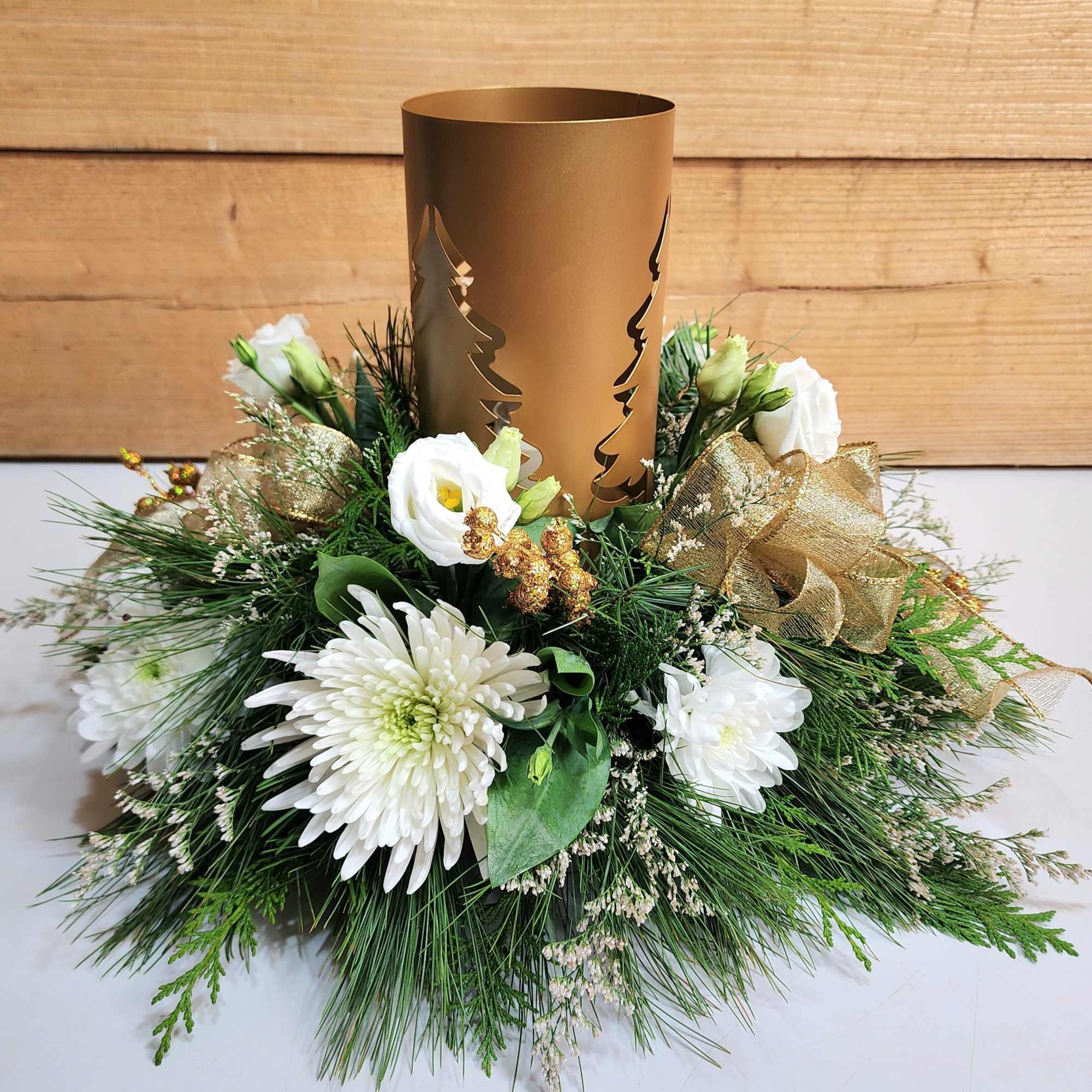Feel the warmth of holiday delight with our Golden Evergreen Centerpiece! This