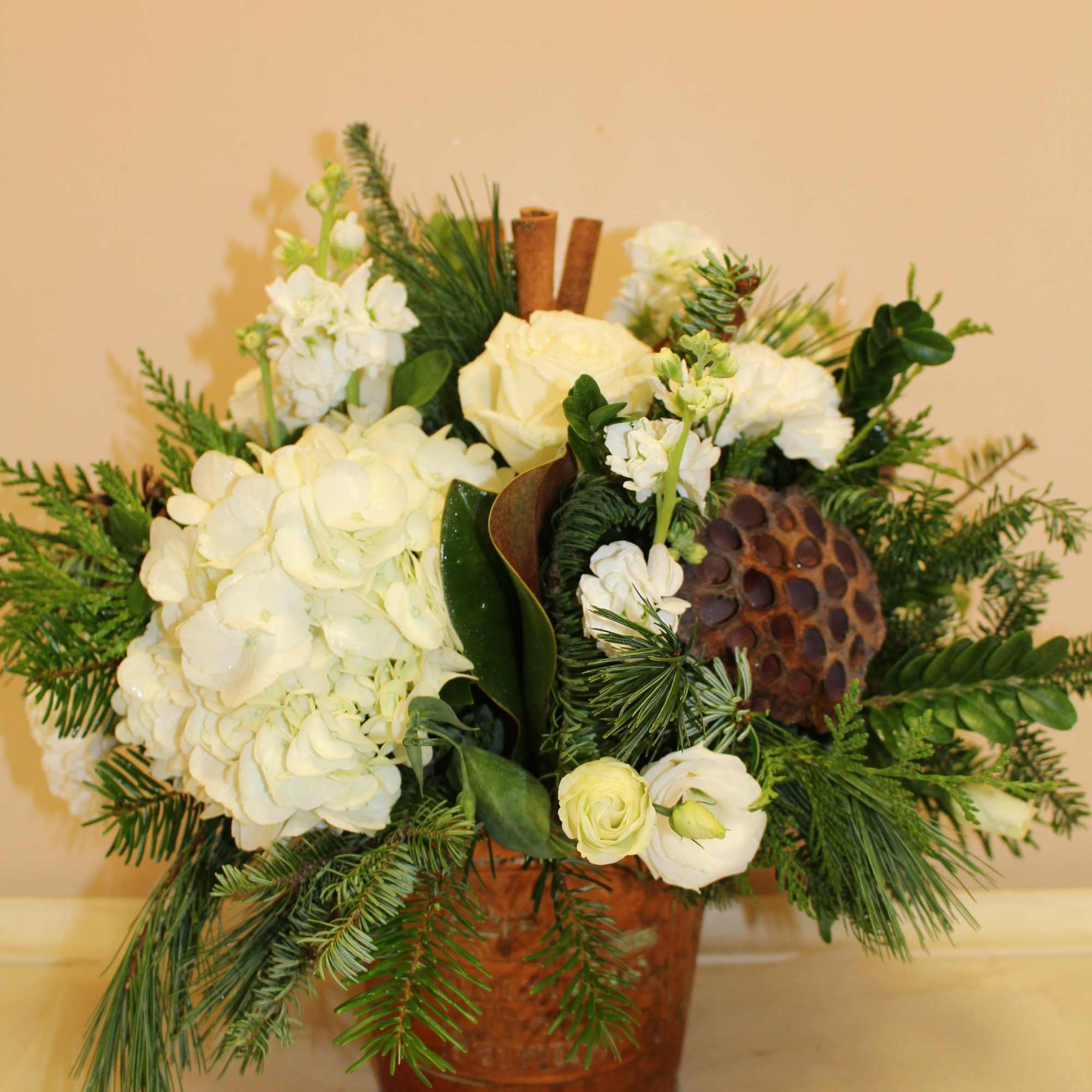 a beautiful copper tin is filled with a woodsie farm time feel