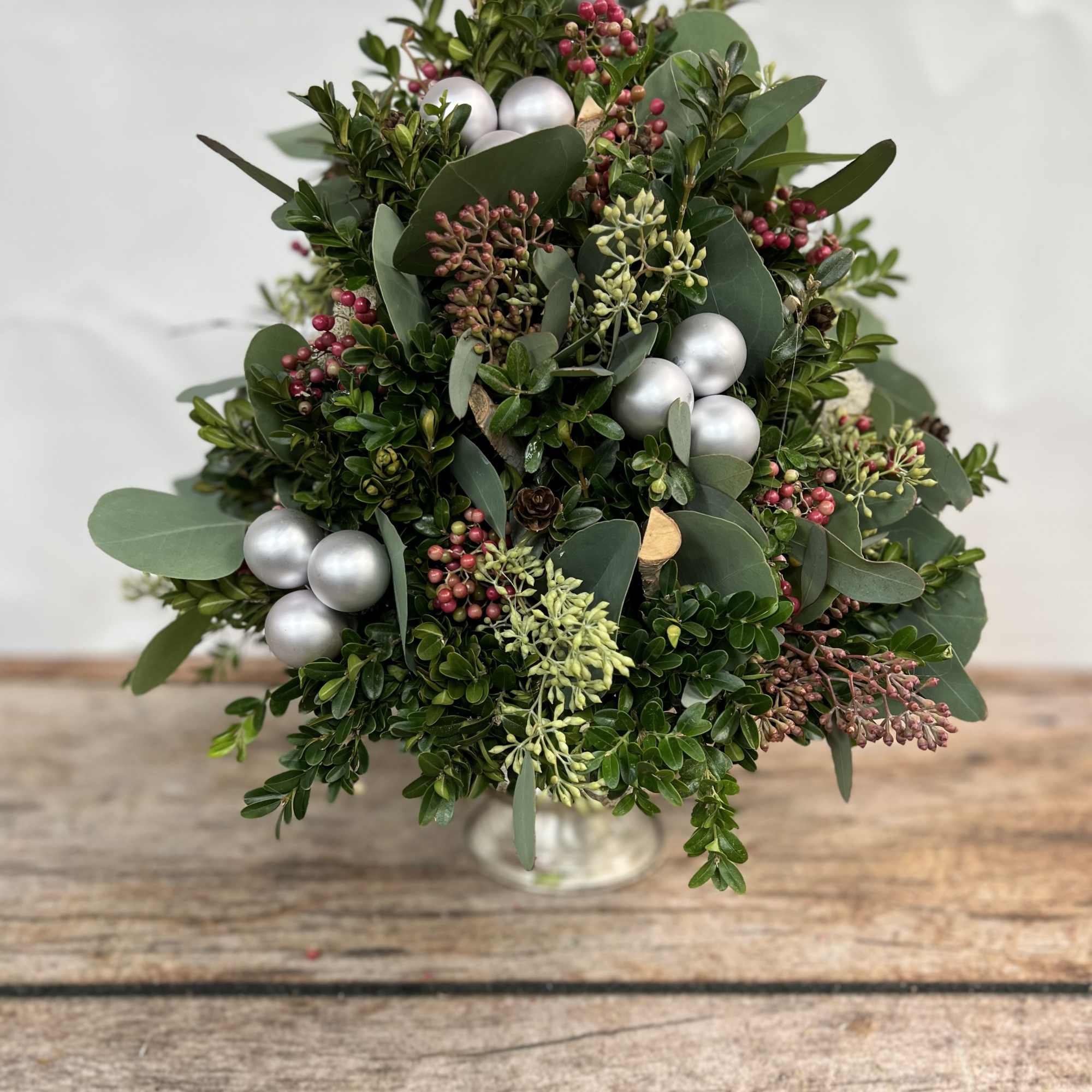 Each stem of boxwood is perfectly placed by our designers replicating a