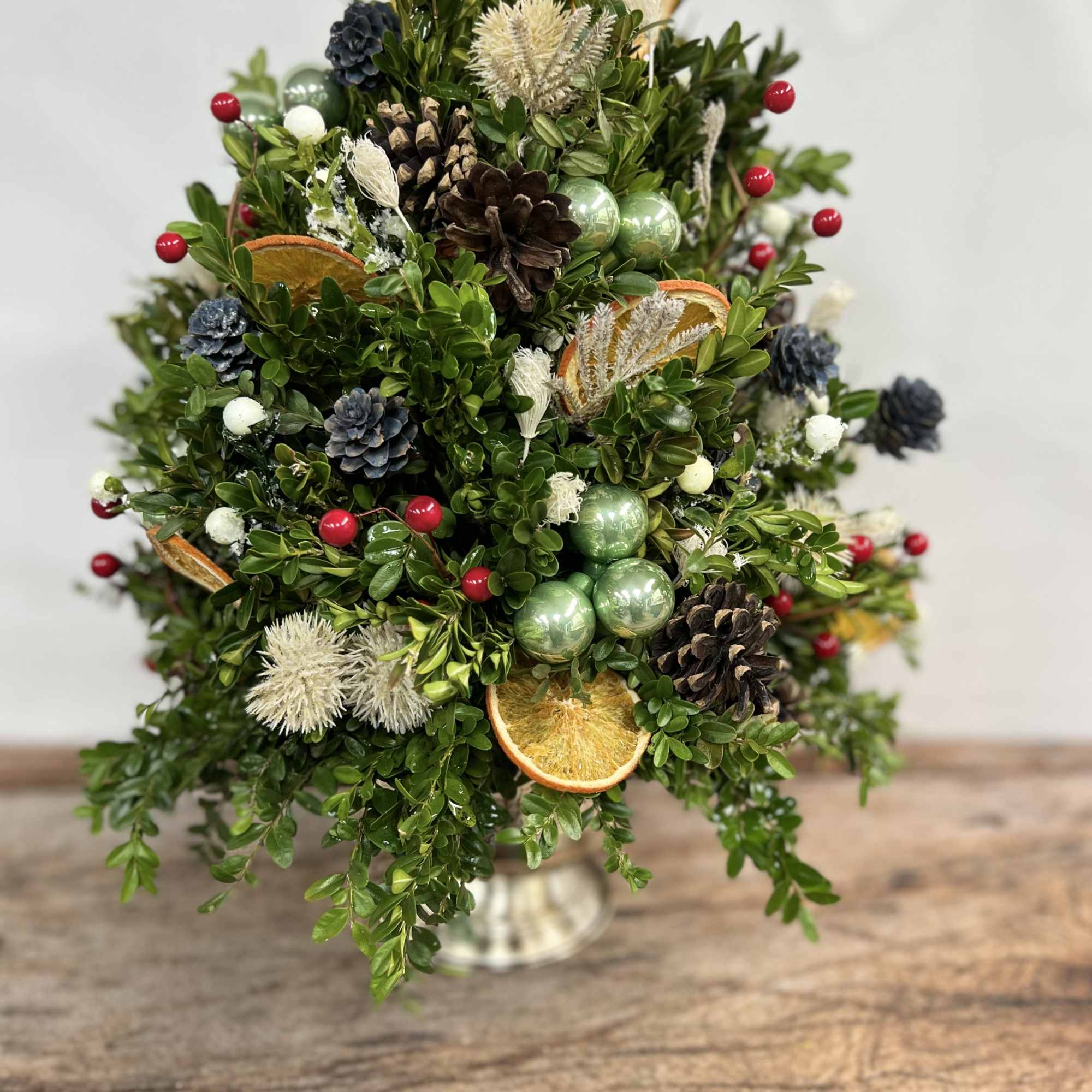 Each stem of boxwood is perfectly placed by our designers replicating a