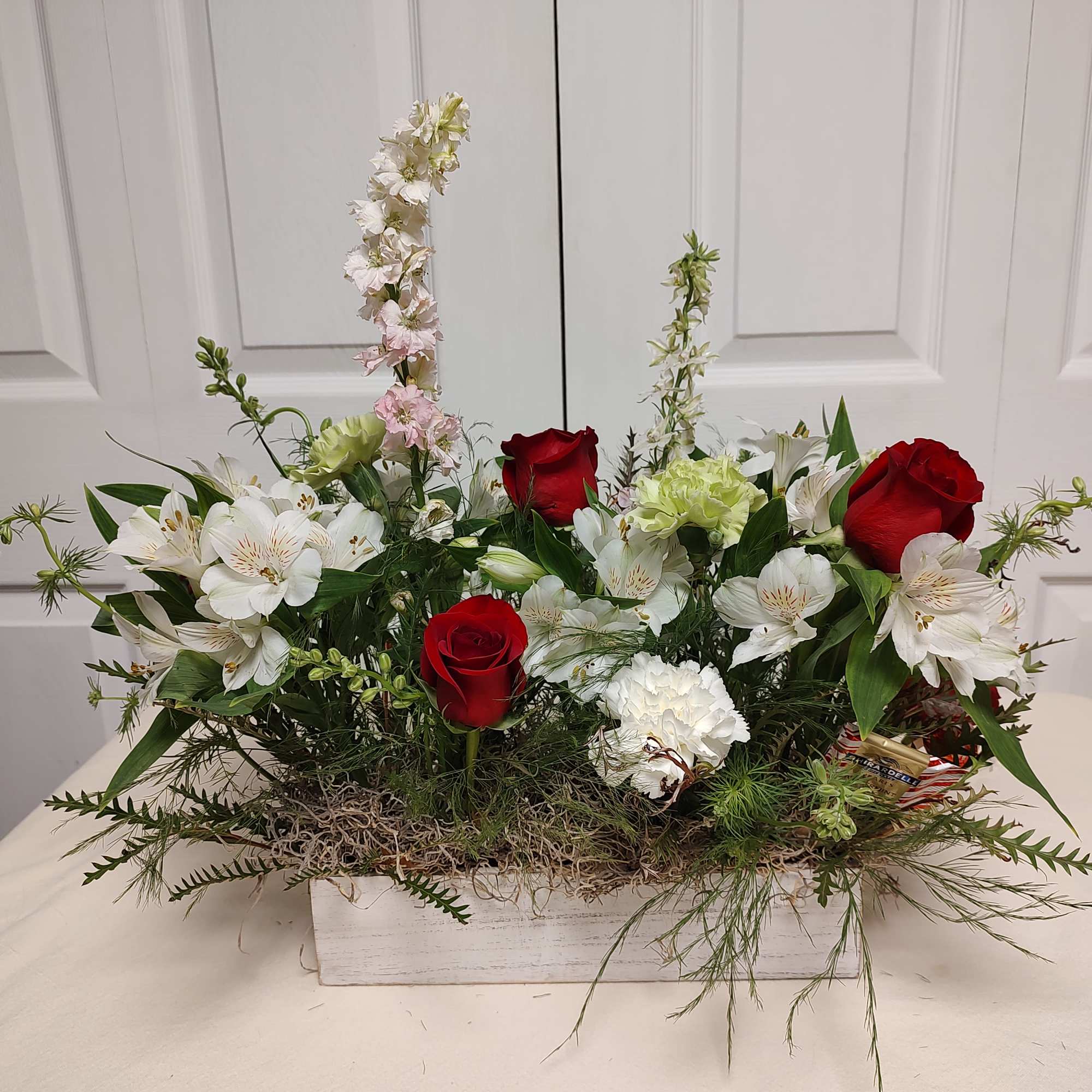 24" long x 12" wide 
Christmas Floral Centerpiece with candy sprinkle in.