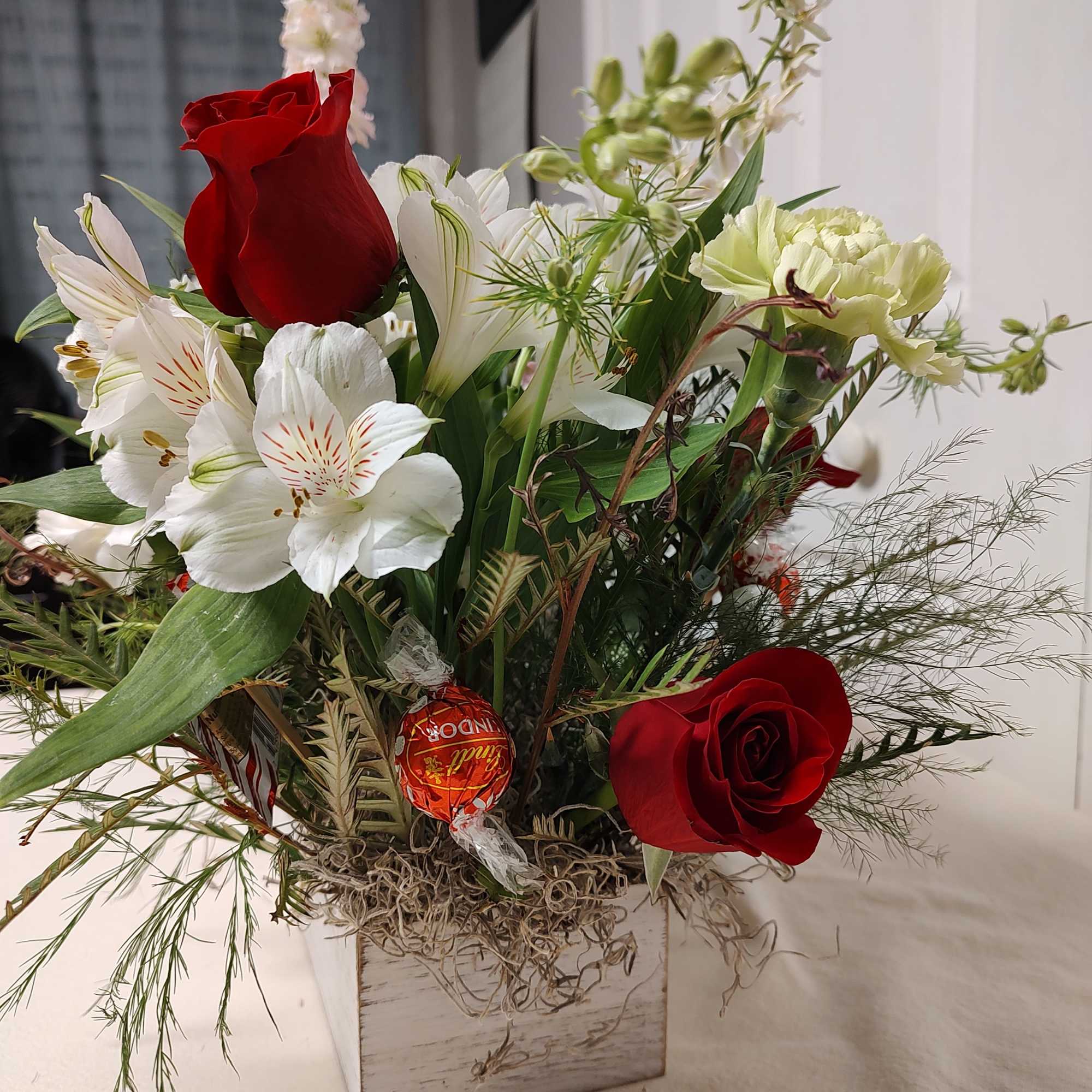 24" long x 12" wide 
Christmas Floral Centerpiece with candy sprinkle in.