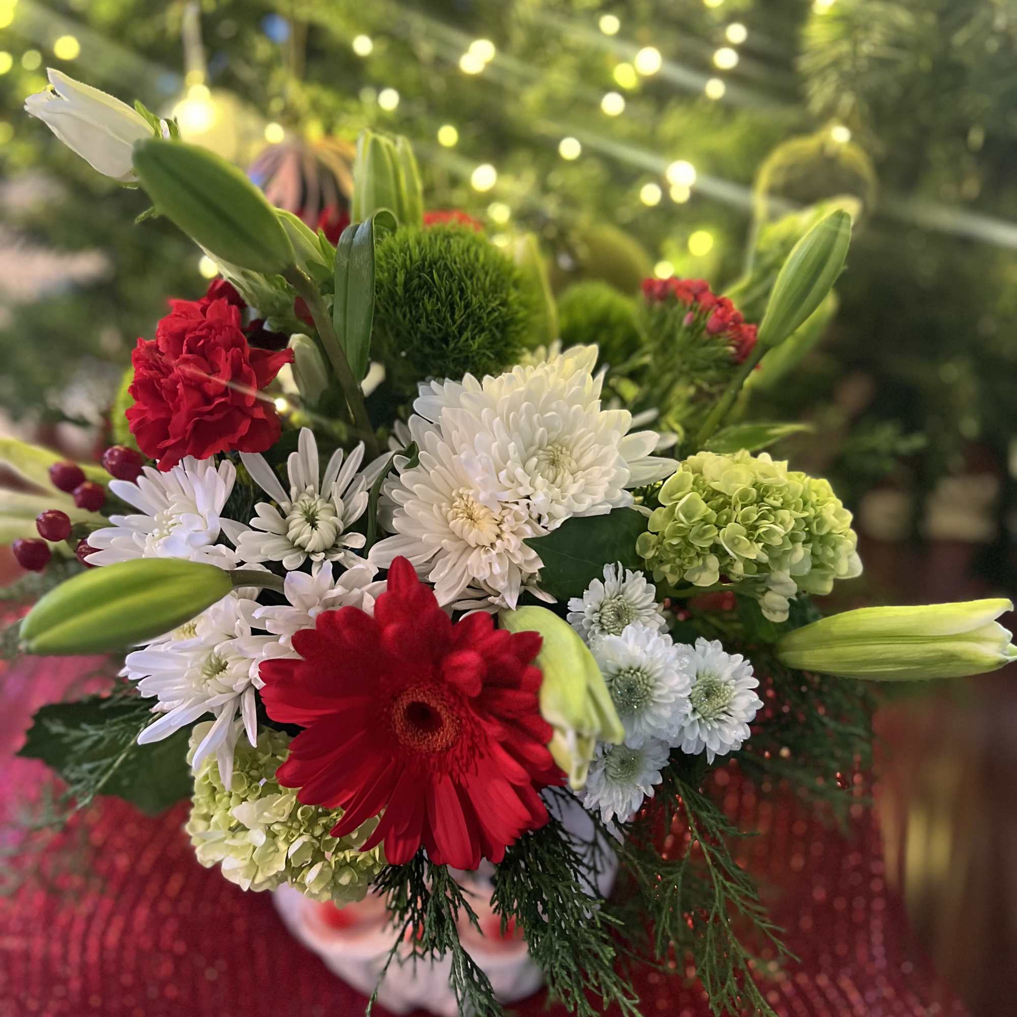 Designers Choice of Christmas florals placed on a large decorative &ldquo;SANTA CLAUSE&rdquo;