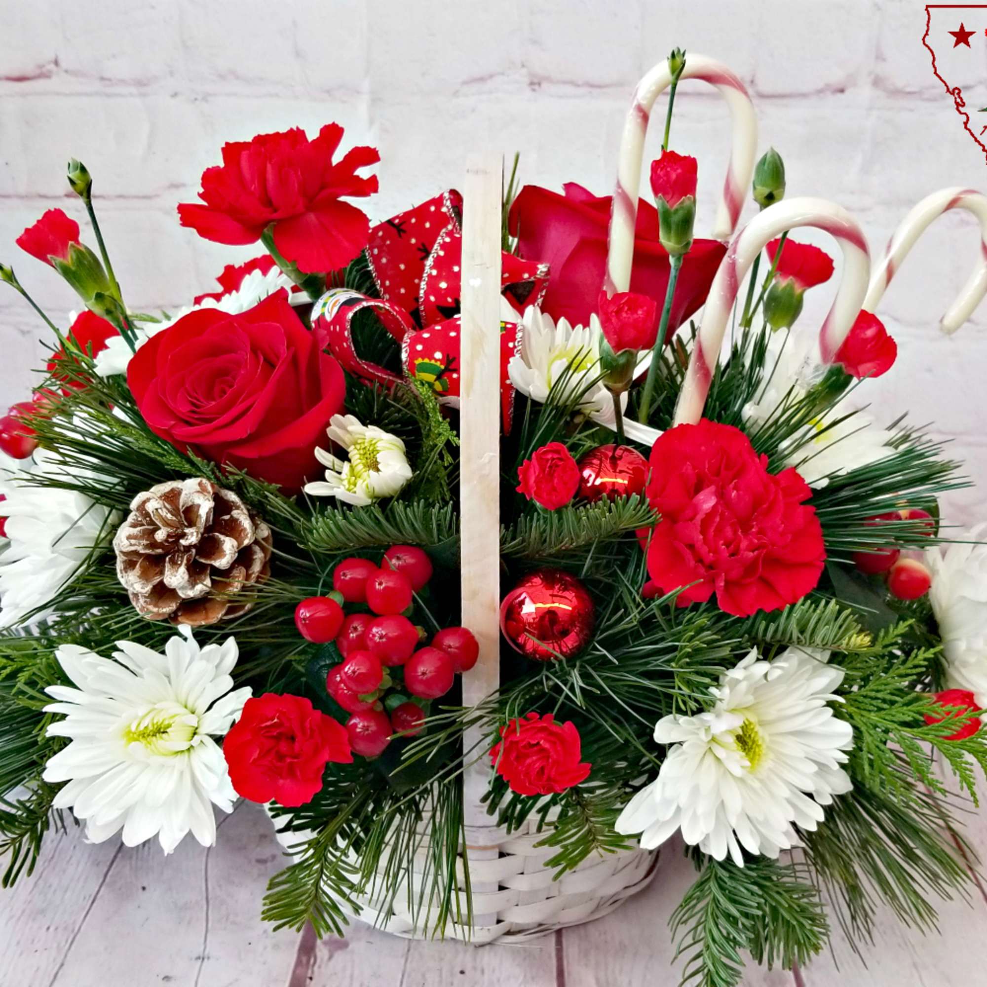 Delight someone with this wicker basket filled with holiday evergreens, long lasting