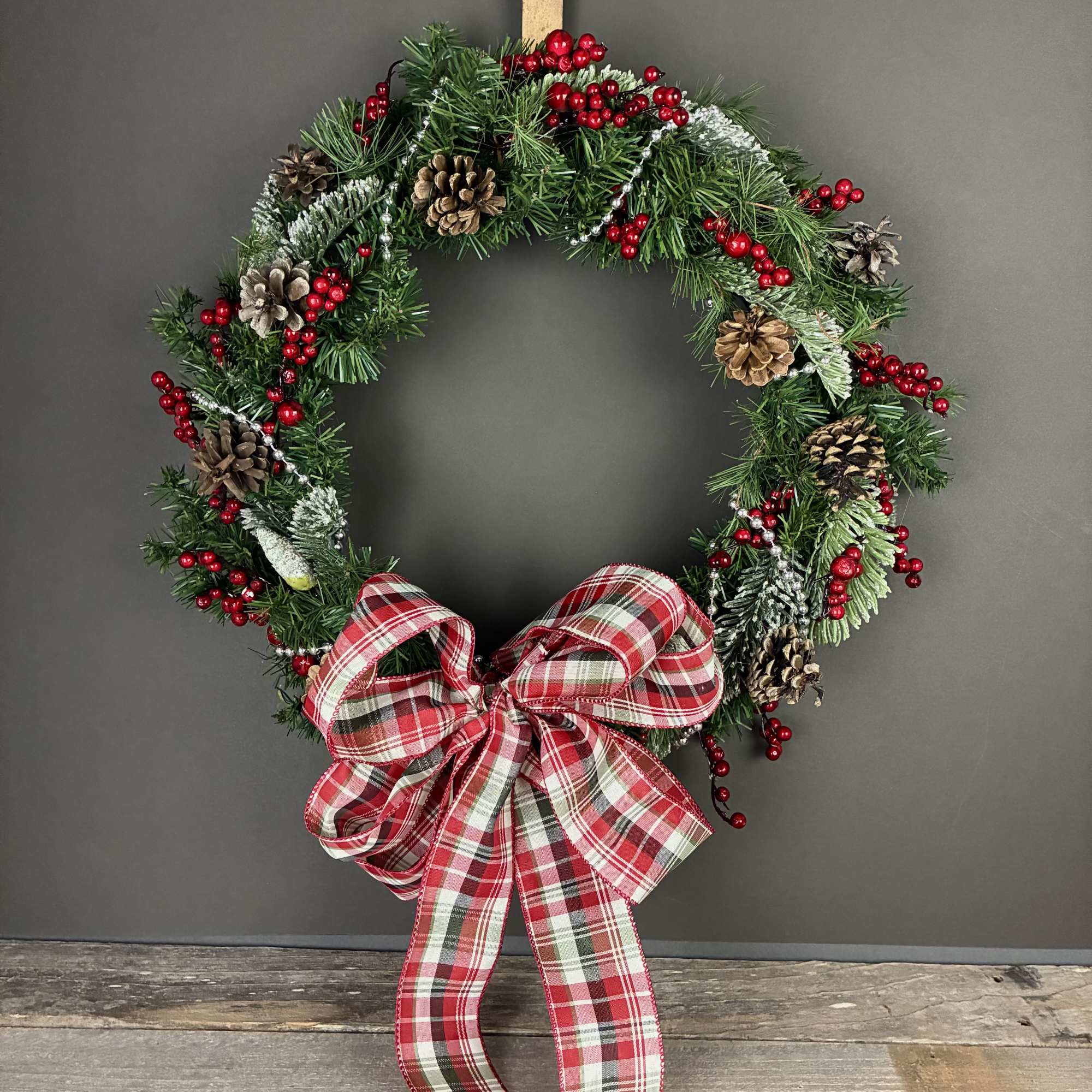 Celebrate the holidays with this one of a kind wreathe featuring red