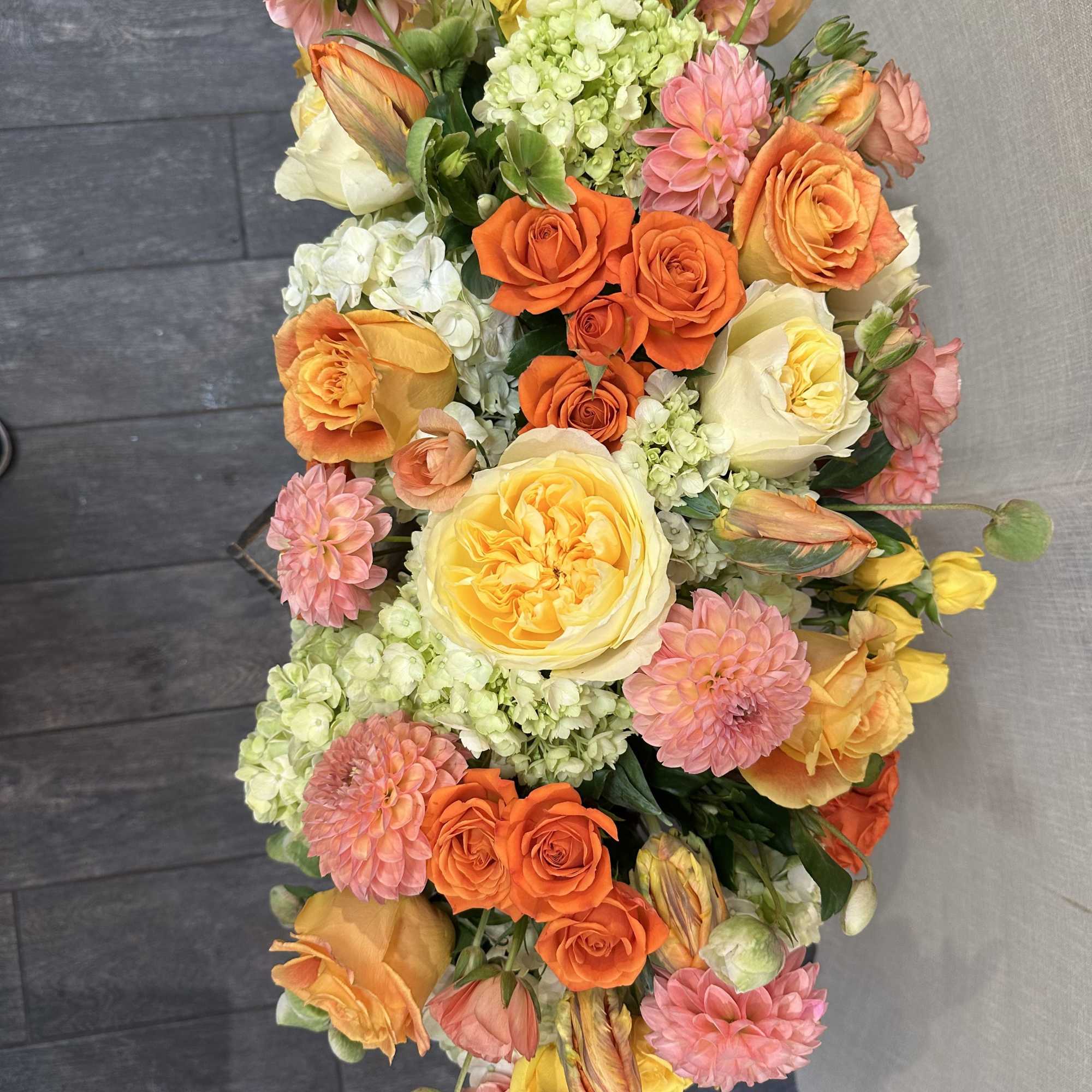 an extremely exotic touch, with GARDEN ROSE, with DAHLIAS, and orange tulips
