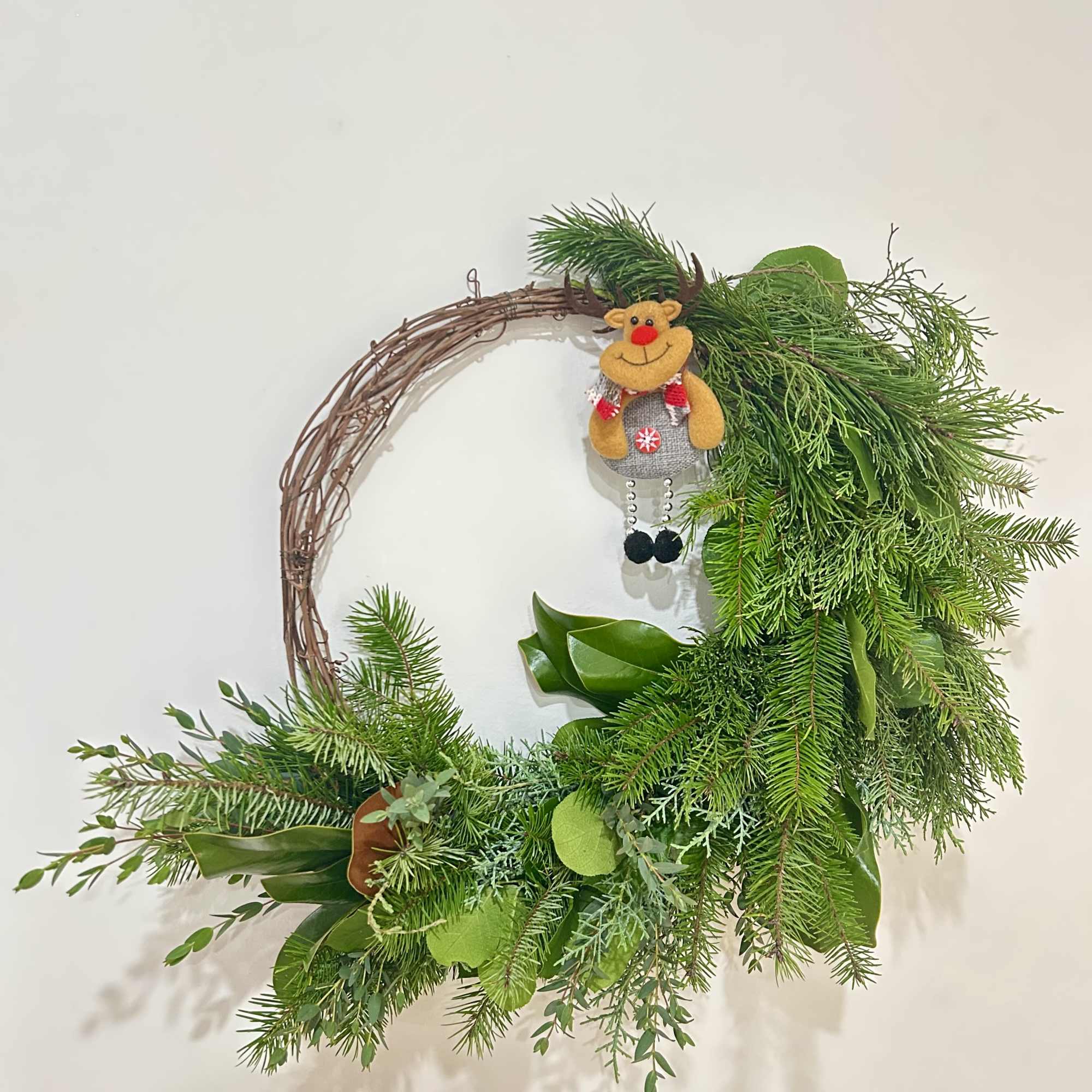 Wreath is available in one size. Decorated with Christmas greenery, ribbons, &amp;