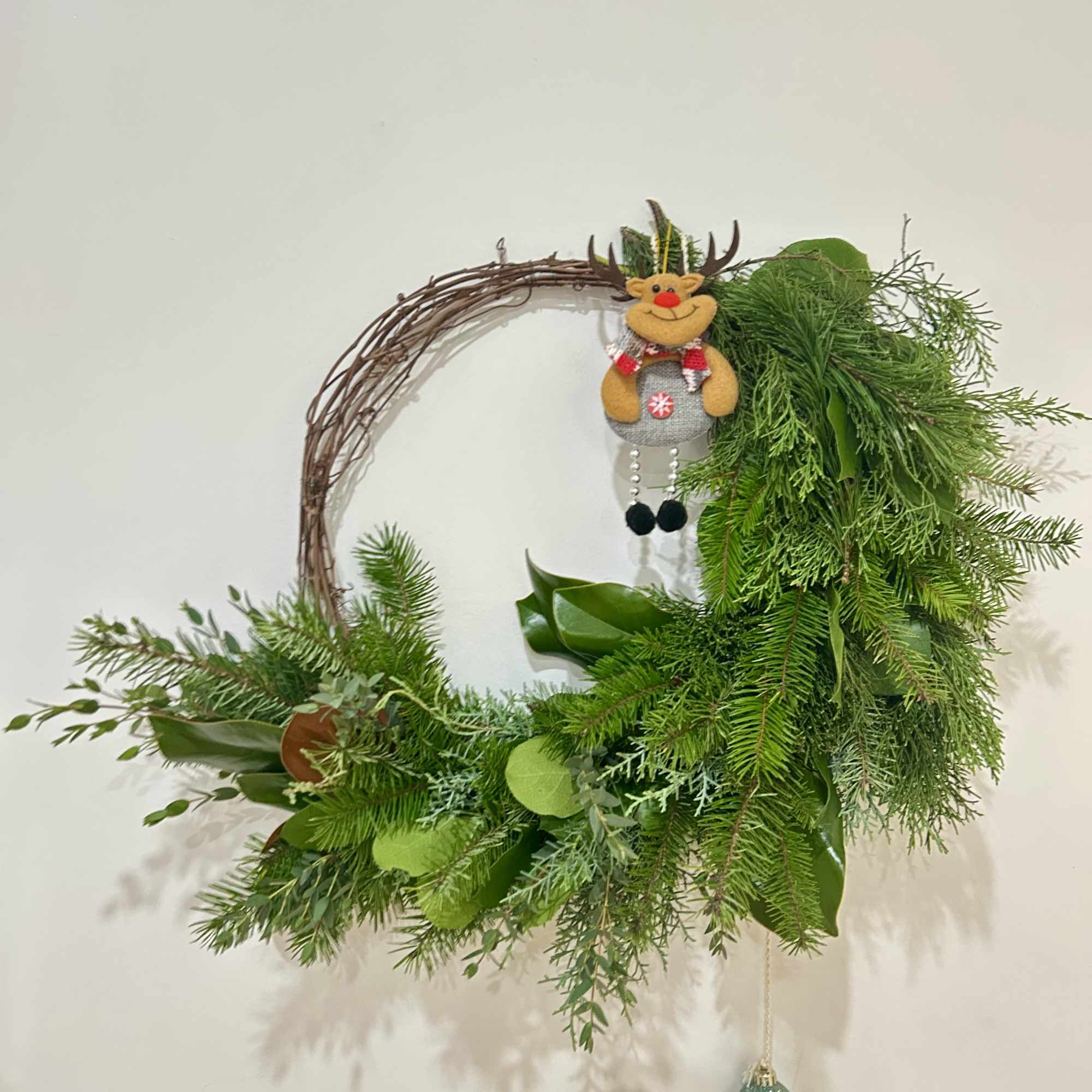 Wreath is available in one size. Decorated with Christmas greenery, ribbons, &amp;