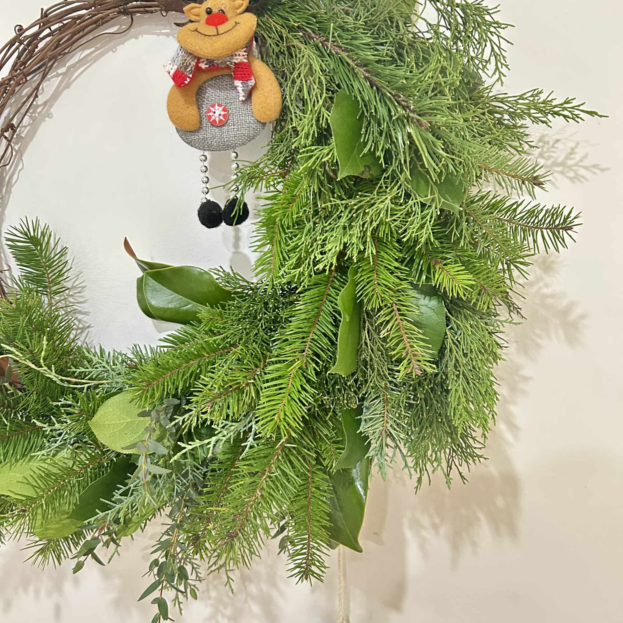 Wreath is available in one size. Decorated with Christmas greenery, ribbons, &amp;